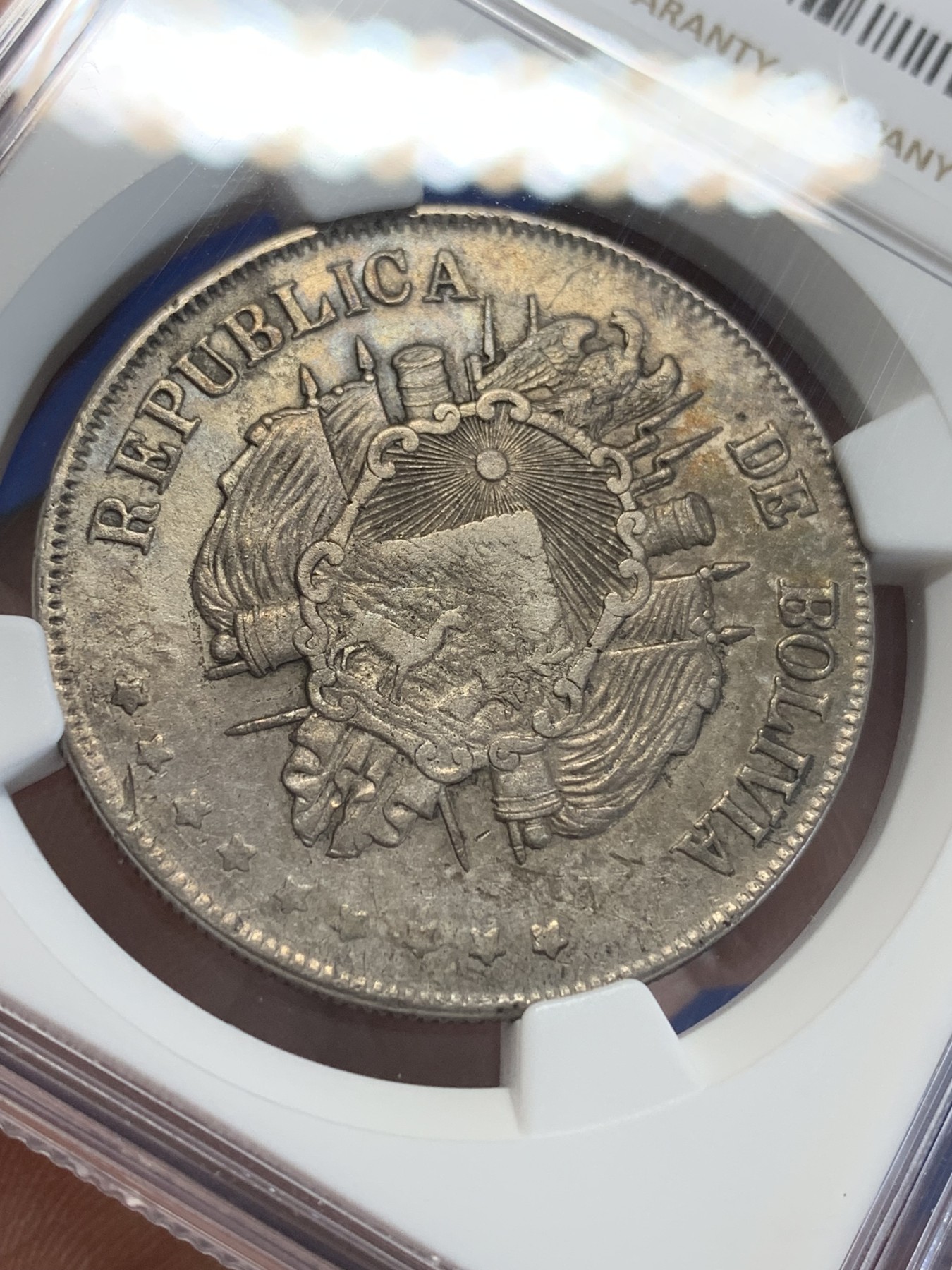 《竞宝斋》第207场-周日，周一 2场 (全场包邮) NGC AUD  1872  玻利维亚1玻利瓦尔银币 热门南美大银 带彩包浆