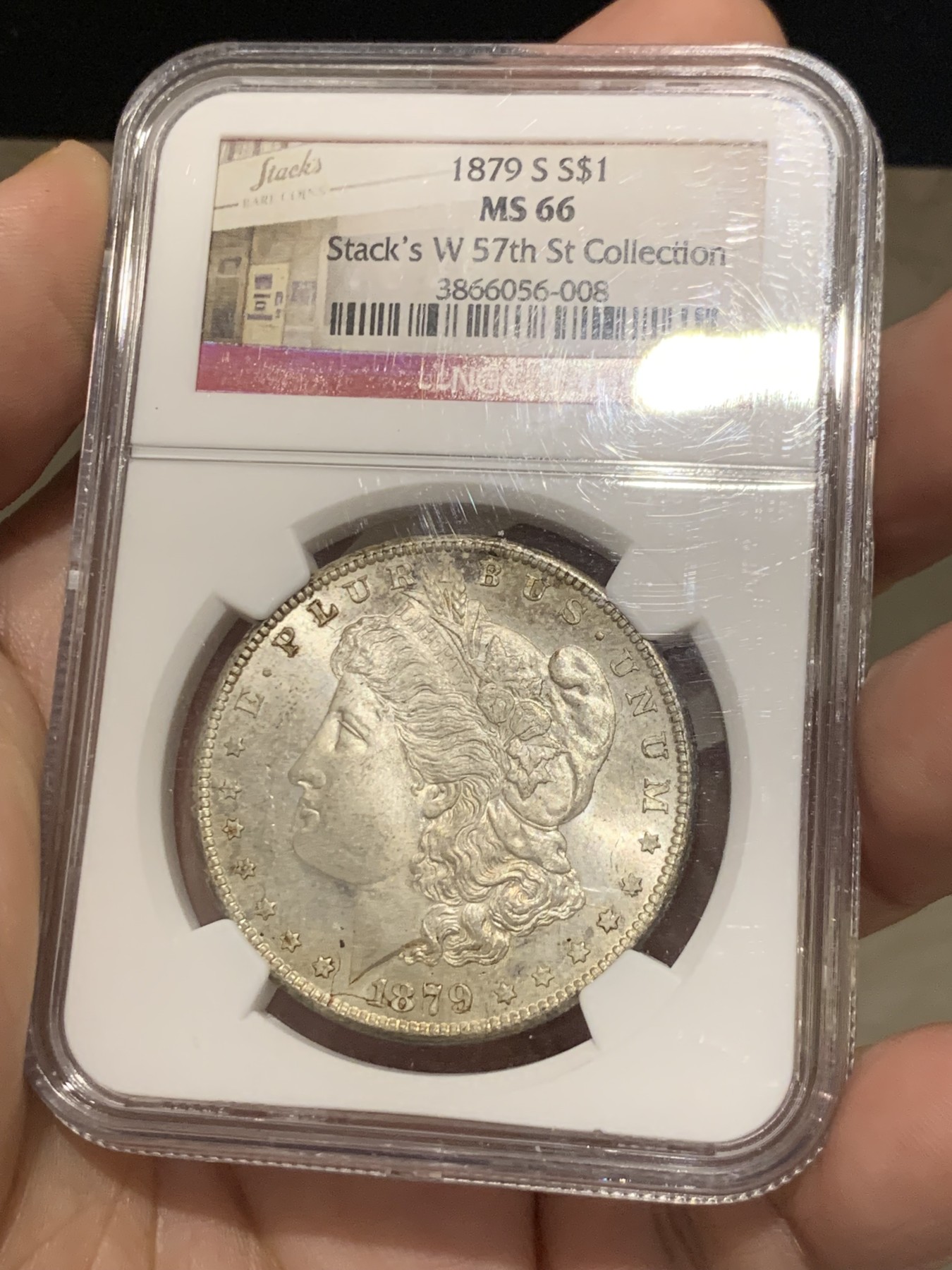 《竞宝斋》第207场-周日，周一 2场 (全场包邮) NGC MS66 美国 1879年S版 摩根1美元 大银币 淡彩十字光 状态非常好，带Stack's 收藏标签 很有意义