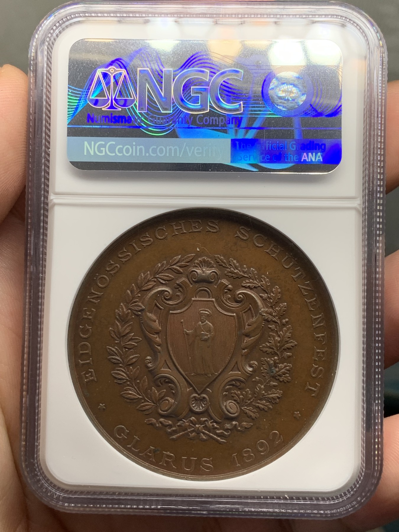 《竞宝斋》第207场-周日，周一 2场 (全场包邮) NGC MS64BN 1892年瑞士格拉鲁斯射击节高浮雕铜章 原味巧克力包浆 顶级品相状态