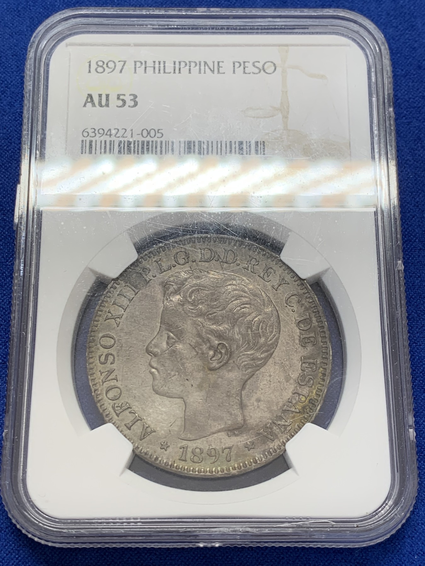 《竞宝斋》第207场-周日，周一 2场 (全场包邮) NGC AU53 西属菲律宾1897年阿方索十三世1比索银币，皮蛋包浆