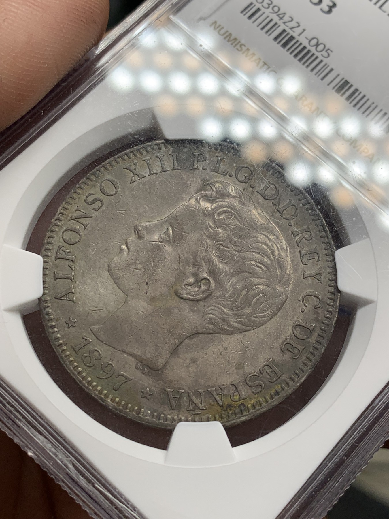 《竞宝斋》第207场-周日，周一 2场 (全场包邮) NGC AU53 西属菲律宾1897年阿方索十三世1比索银币，皮蛋包浆