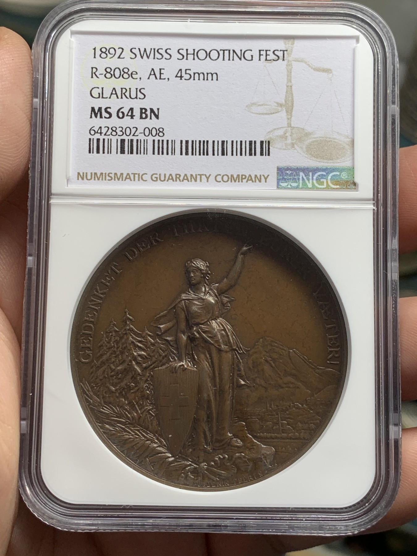 《竞宝斋》第207场-周日，周一 2场 (全场包邮) NGC MS64BN 1892年瑞士格拉鲁斯射击节高浮雕铜章 原味巧克力包浆 顶级品相状态