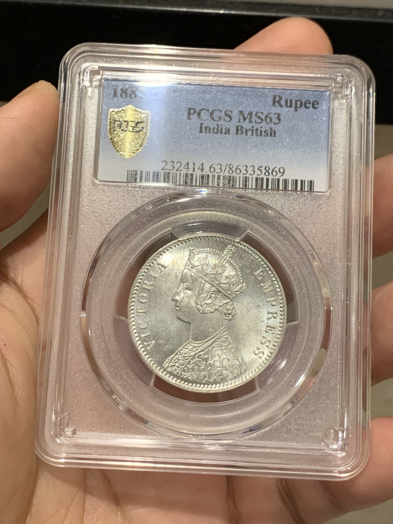 《竞宝斋》第207场-周日，周一 2场 (全场包邮) PCGS-MS63 英属印度1887年维多利亚1卢比银币