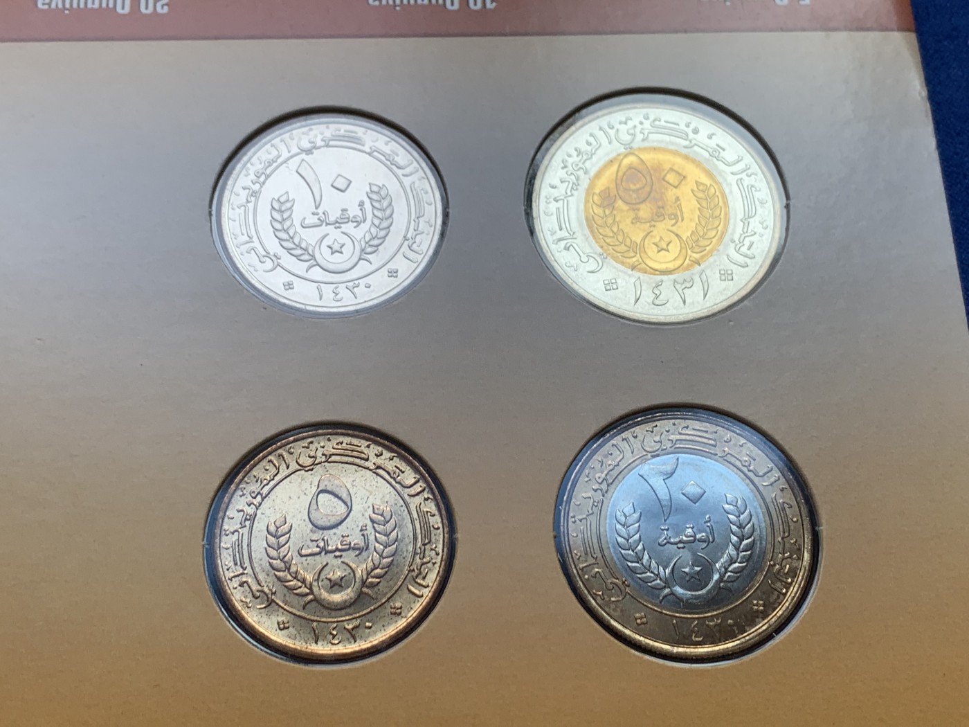 《竞宝斋》第207场-周日，周一 2场 (全场包邮) 毛里塔尼亚2009-10四枚密封套币，含两枚双色币，unc-bu强光好品！