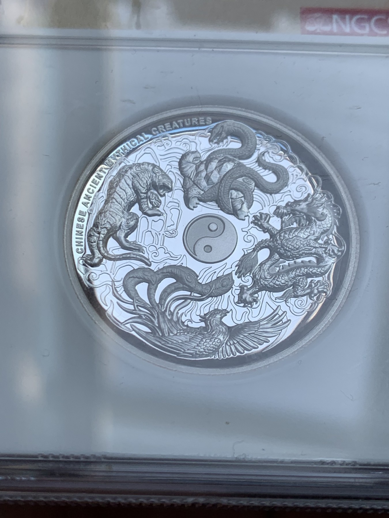 《竞宝斋》第207场-周日，周一 2场 (全场包邮) NGC PF70 Ultra Cameo 2016年图瓦卢1美元纪念银币，中国四大神兽题材，超高浮雕凹形镜面工艺精美绝伦，加厚盒封装特殊龙凤标签 盒证齐全！
