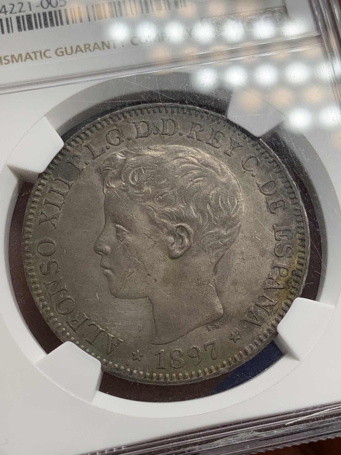 《竞宝斋》第207场-周日，周一 2场 (全场包邮) NGC AU53 西属菲律宾1897年阿方索十三世1比索银币，皮蛋包浆