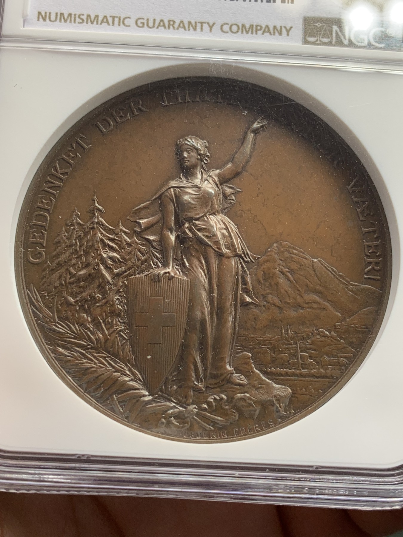 《竞宝斋》第207场-周日，周一 2场 (全场包邮) NGC MS64BN 1892年瑞士格拉鲁斯射击节高浮雕铜章 原味巧克力包浆 顶级品相状态