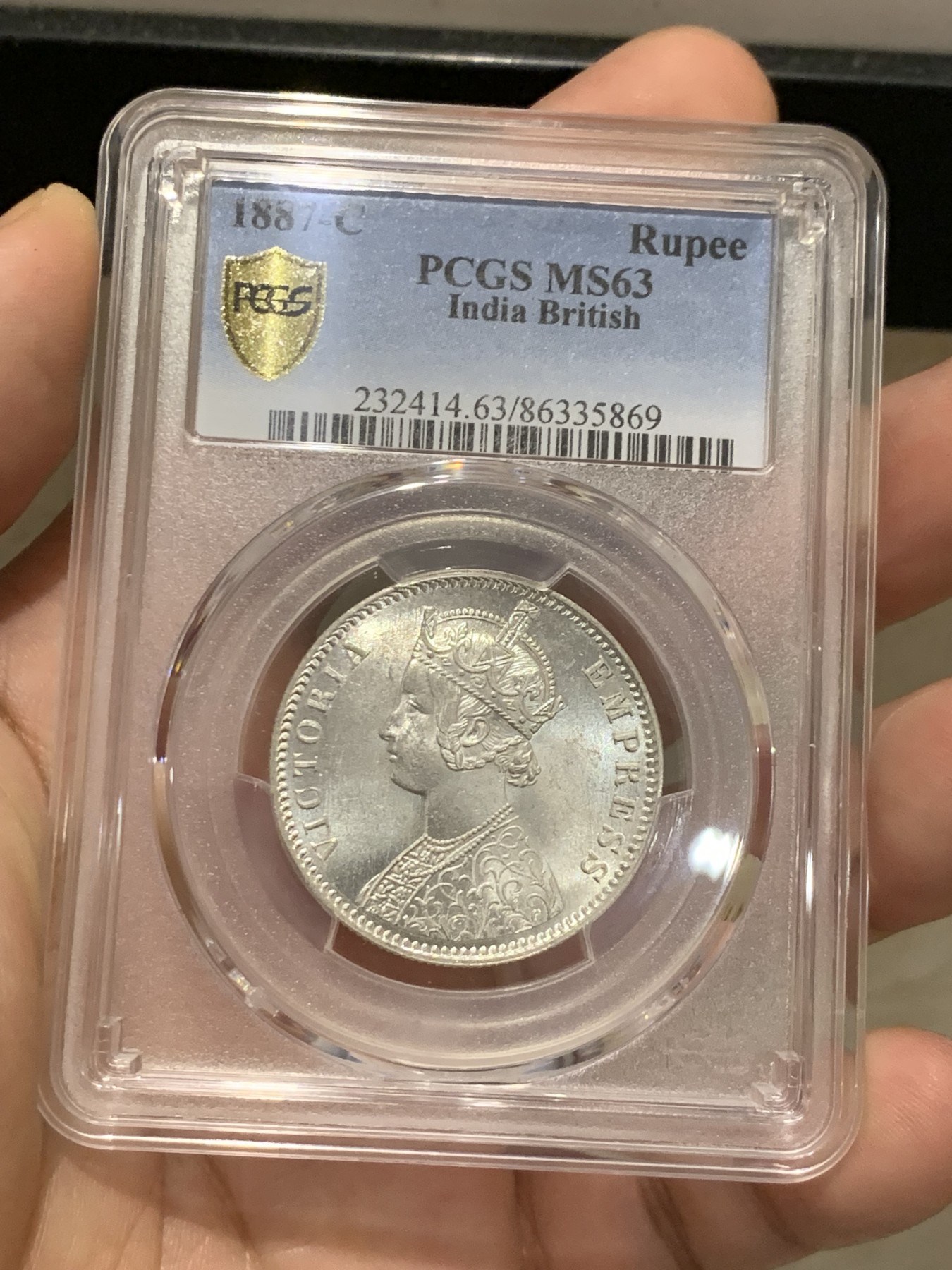 《竞宝斋》第207场-周日，周一 2场 (全场包邮) PCGS-MS63 英属印度1887年维多利亚1卢比银币