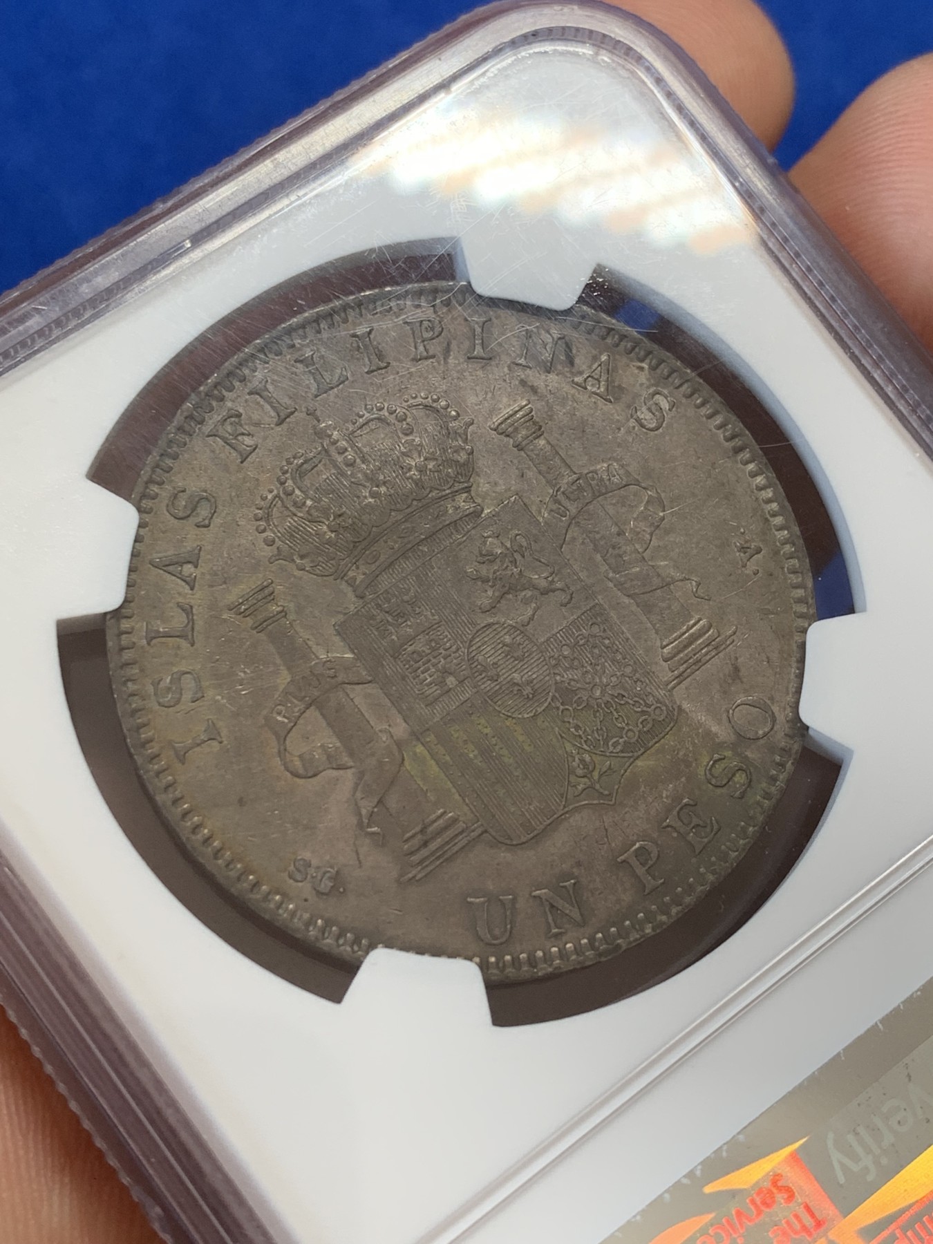 《竞宝斋》第207场-周日，周一 2场 (全场包邮) NGC AU53 西属菲律宾1897年阿方索十三世1比索银币，皮蛋包浆