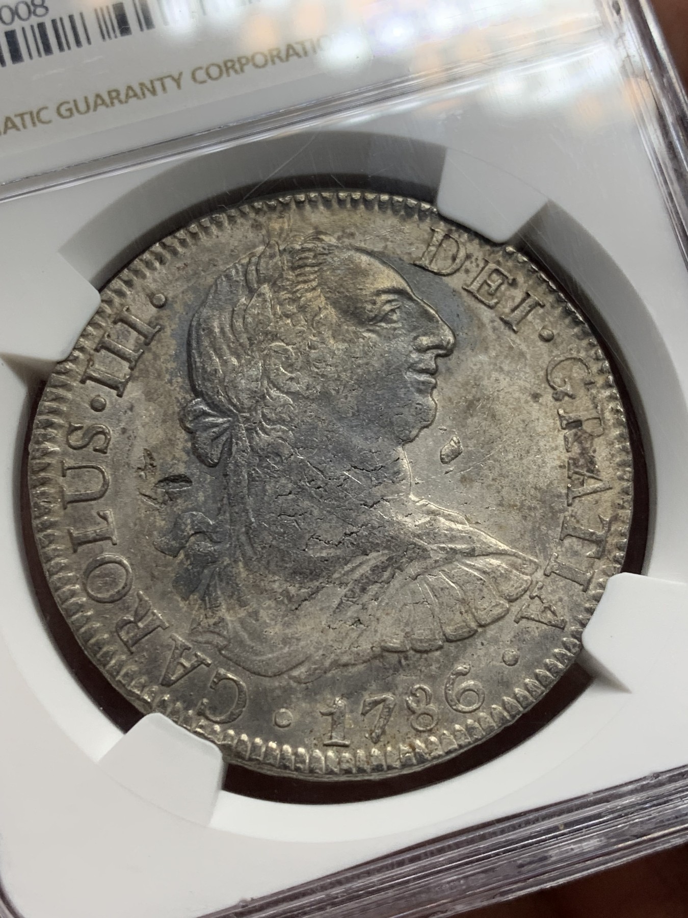 《竞宝斋》第208场-周日，周一 2场 (全场包邮) NGC AU 墨西哥1786MO 卡三8R双柱大银币 有小戳 整体深打 不错