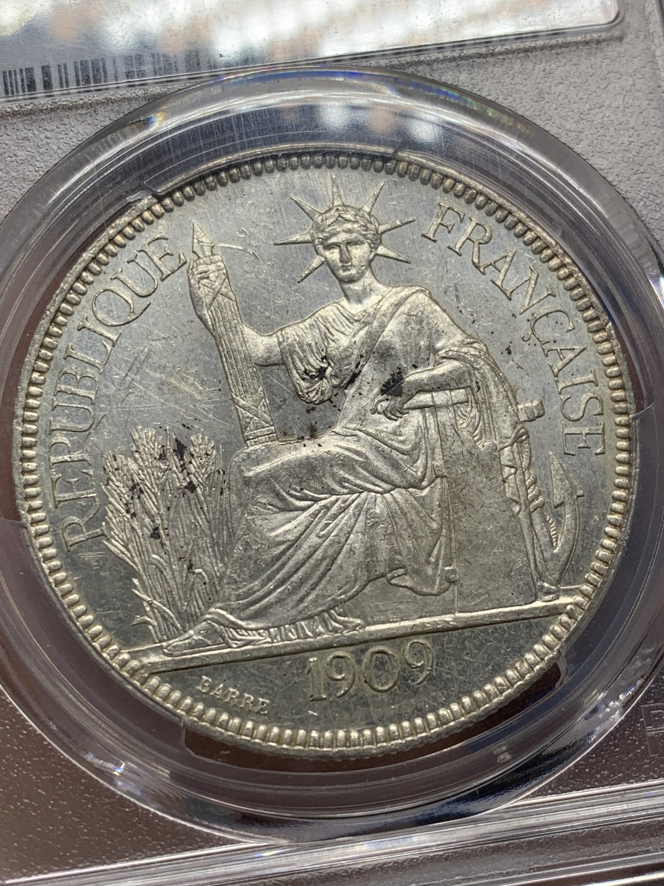 《竞宝斋》第208场-周日，周一 2场 (全场包邮) PCGS UNC 法属坐洋1皮亚斯特银币 1909A 原光 状态极好