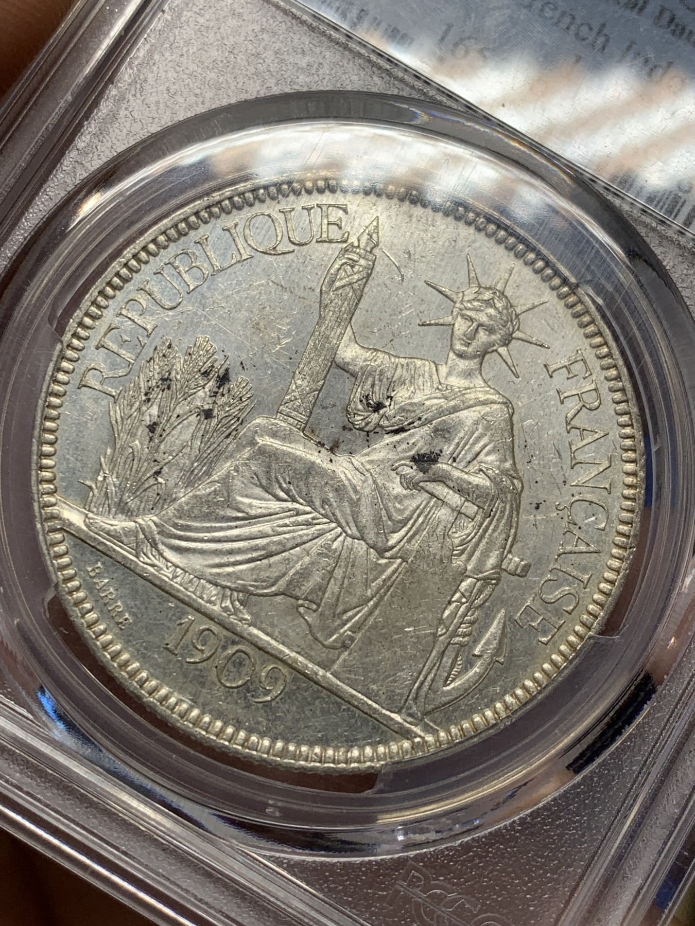 《竞宝斋》第208场-周日，周一 2场 (全场包邮) PCGS UNC 法属坐洋1皮亚斯特银币 1909A 原光 状态极好