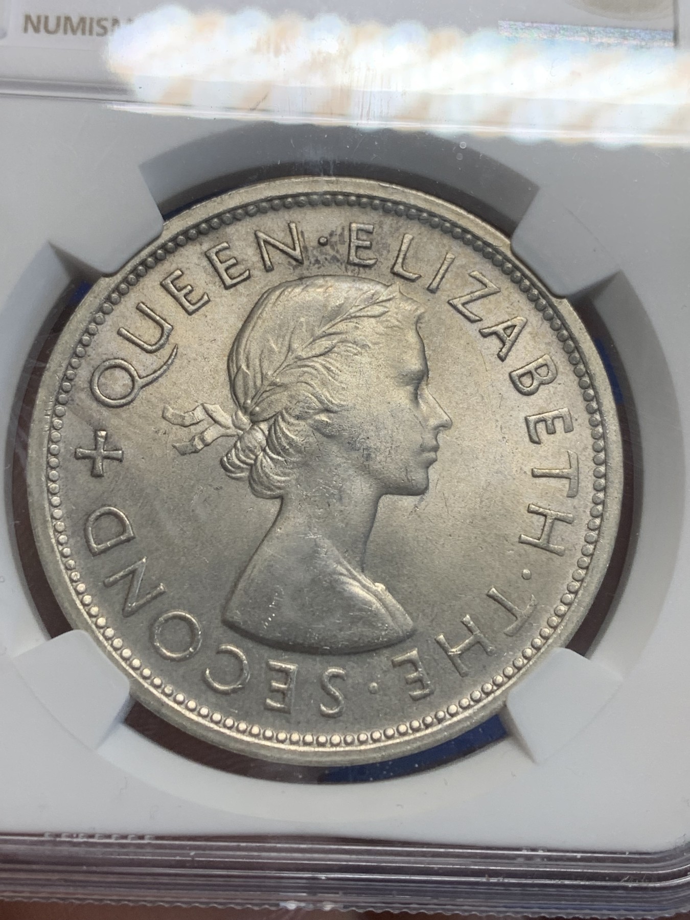 《竞宝斋》第209场-周日，周一 2场 (全场包邮) NGC MS64 南罗德西亚（津巴布韦）1953年纪念罗德斯诞辰一百周年一克朗大银币 全新转光