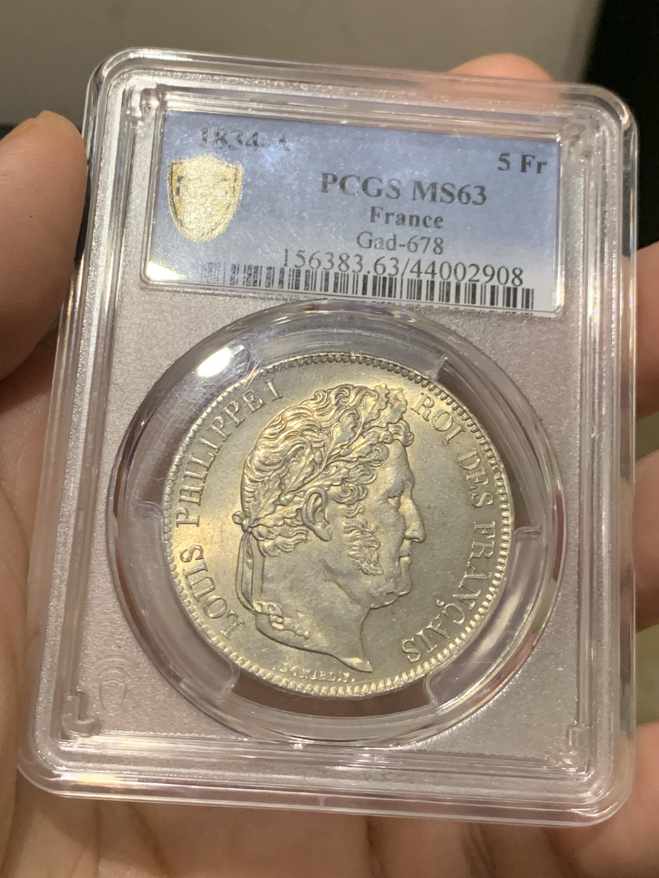 《竞宝斋》第209场-周日，周一 2场 (全场包邮) PCGS MS63 法国1834菲利普一世5法郎银币，淡黄包浆 丝绸底板，少见年份 冠军分也是广告封面币。