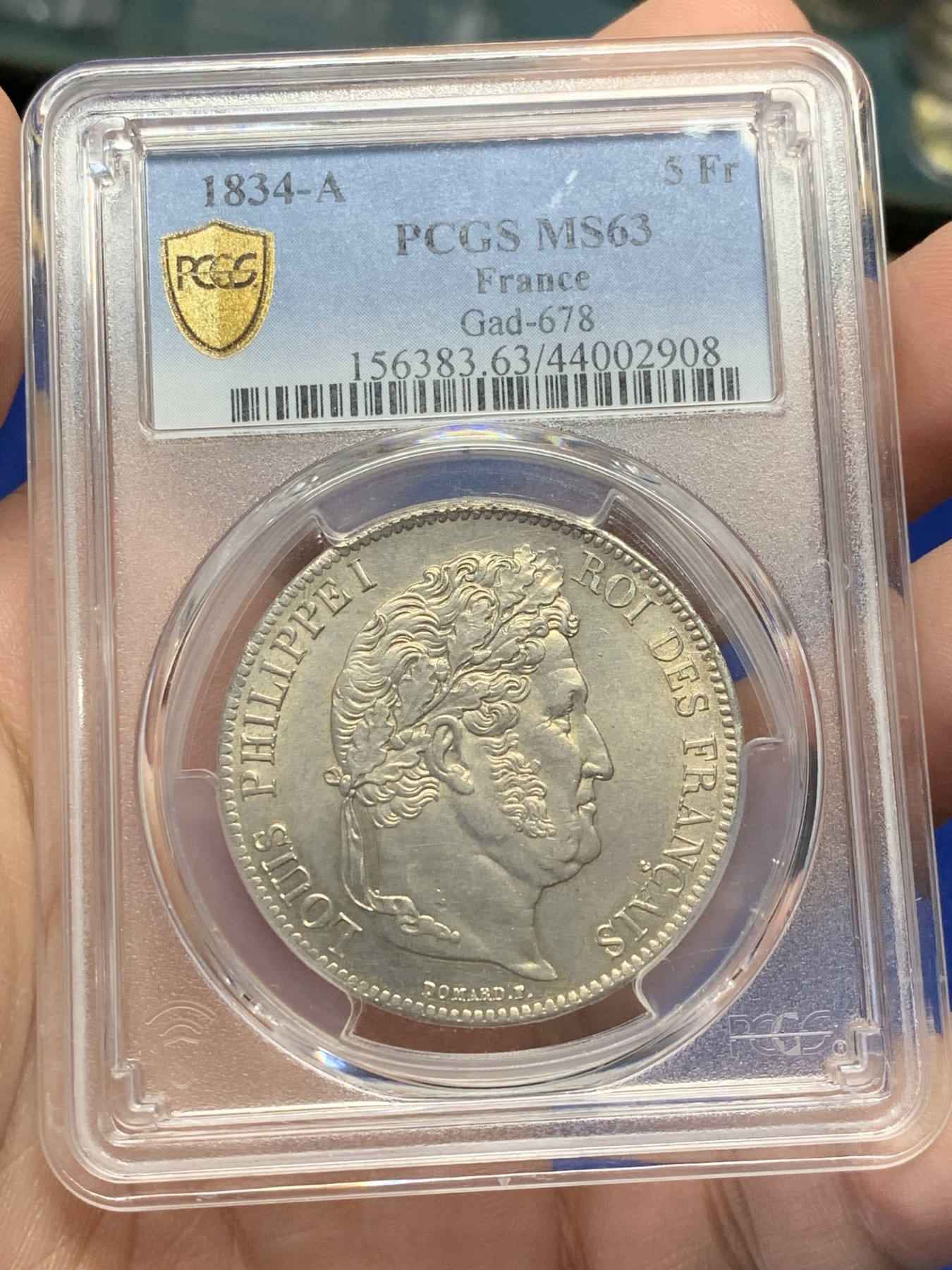《竞宝斋》第209场-周日，周一 2场 (全场包邮) PCGS MS63 法国1834菲利普一世5法郎银币，淡黄包浆 丝绸底板，少见年份 冠军分也是广告封面币。