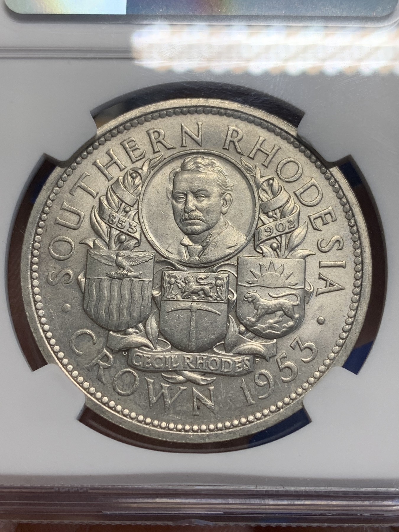 《竞宝斋》第209场-周日，周一 2场 (全场包邮) NGC MS64 南罗德西亚（津巴布韦）1953年纪念罗德斯诞辰一百周年一克朗大银币 全新转光