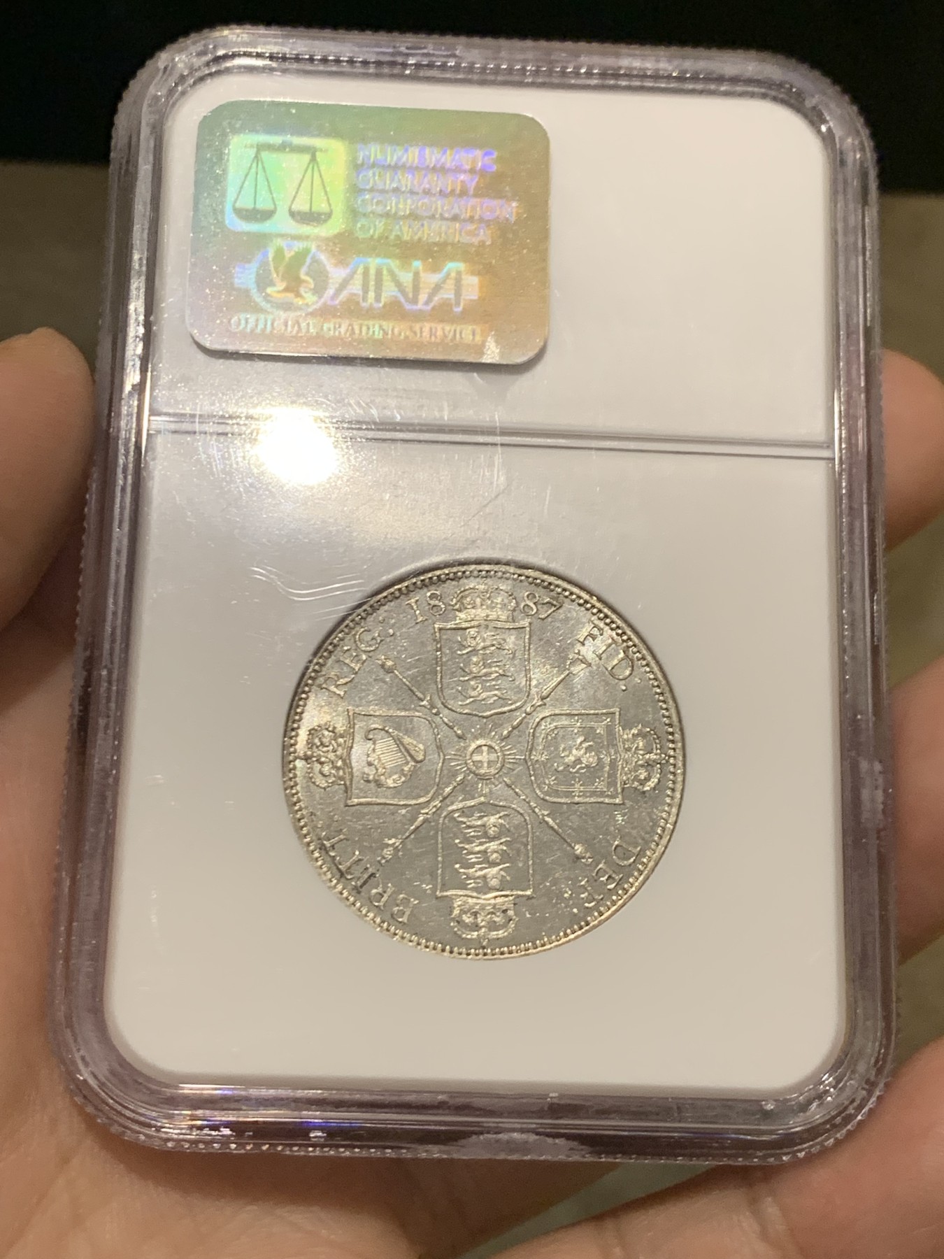 《竞宝斋》第209场-周日，周一 2场 (全场包邮) NGC-MS63PL 1887年 英国 维多利亚女王 2先令 大银币   少见的NGC认证的PL镜面初铸精制底板，老盒严评，能评上PL的屈指可数，季军，更高分仅1枚