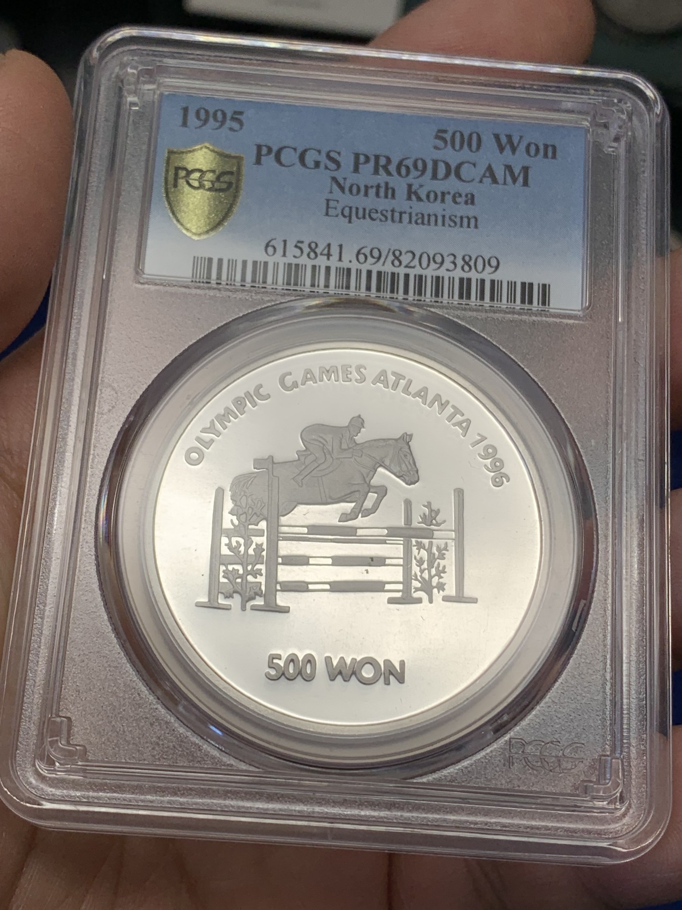 《竞宝斋》第215场-周日，周一 2场 (全场包邮) PCGS PR69 1995年朝鲜发行奥运会马术，中央版大银币，非常难得！