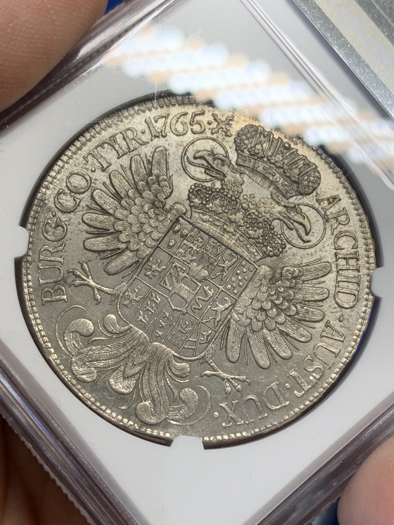 《竞宝斋》第215场-周日，周一 2场 (全场包邮) NGC-UNC 神圣罗马帝国 1765 1泰勒 玛丽亚特蕾莎大银币 维也纳造币厂 淡金彩 正面表面极浅划痕