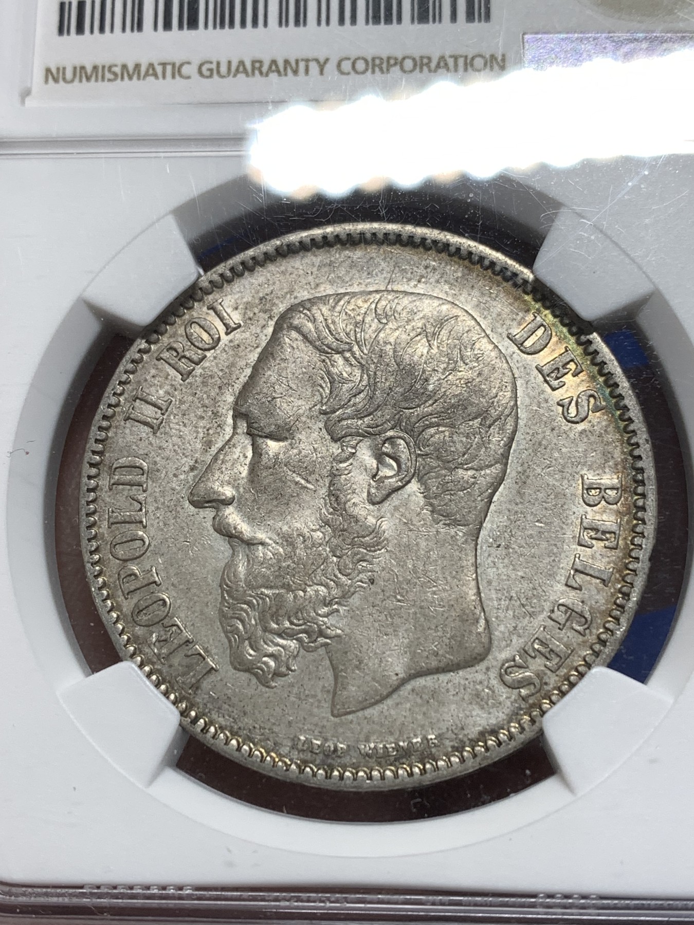 《竞宝斋》第215场-周日，周一 2场 (全场包邮) NGC AUD 比利时 1869年5法郎 利奥波德 大胡子银币 包浆极好，适合砸盒把玩