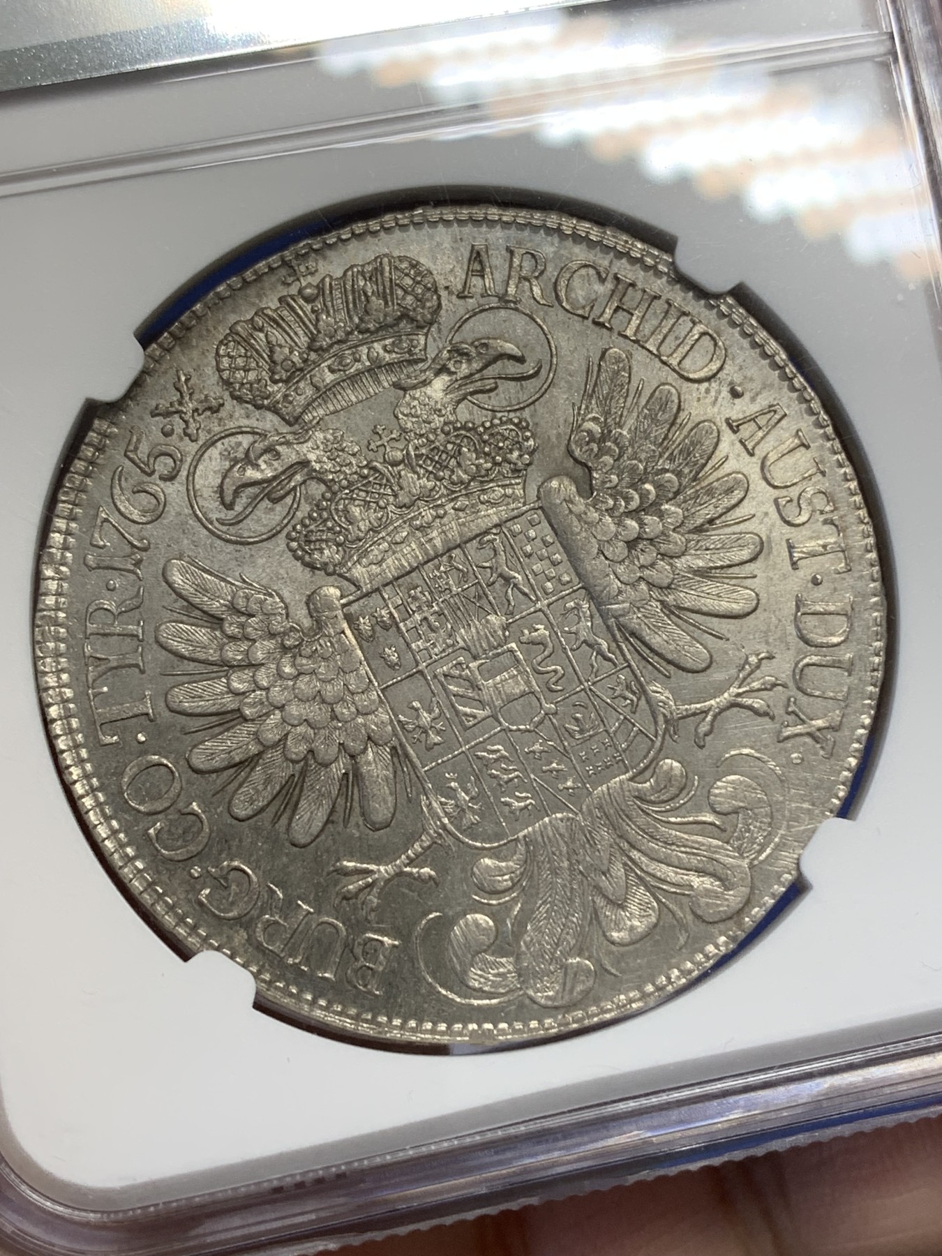 《竞宝斋》第215场-周日，周一 2场 (全场包邮) NGC-UNC 神圣罗马帝国 1765 1泰勒 玛丽亚特蕾莎大银币 维也纳造币厂 淡金彩 正面表面极浅划痕