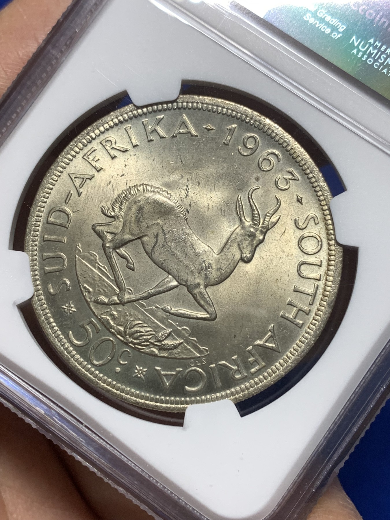 《竞宝斋》第215场-周日，周一 2场 (全场包邮) NGC-MS63 南非 1963年50分 吕贝克 大羚羊银币 极美黄包浆 MS-63 上海严评 早期天印67分砸盒结果