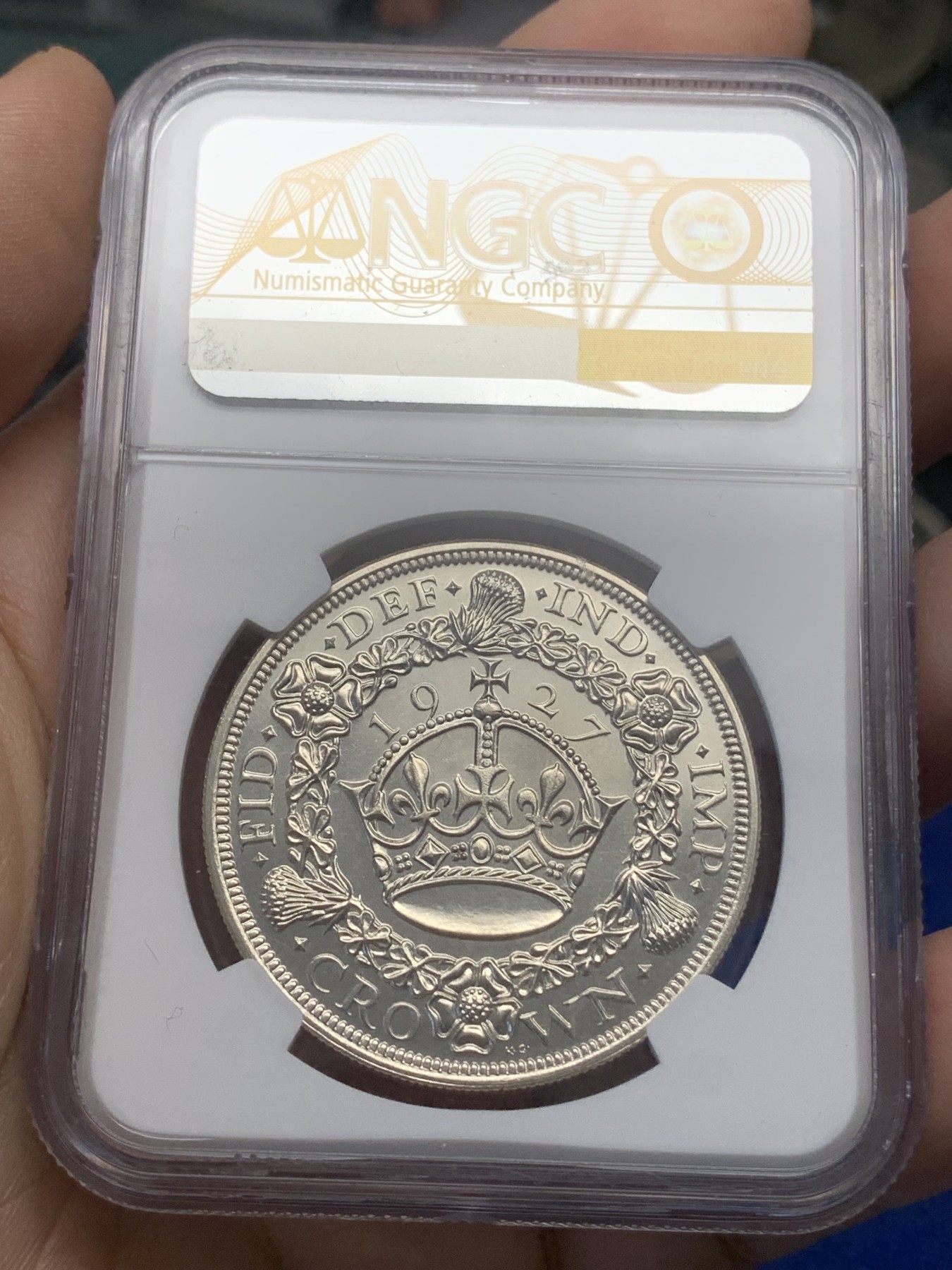 《竞宝斋》第215场-周日，周一 2场 (全场包邮) NGC PF64 英国1927年乔治五世精制花冠一克朗银币，精制镜面