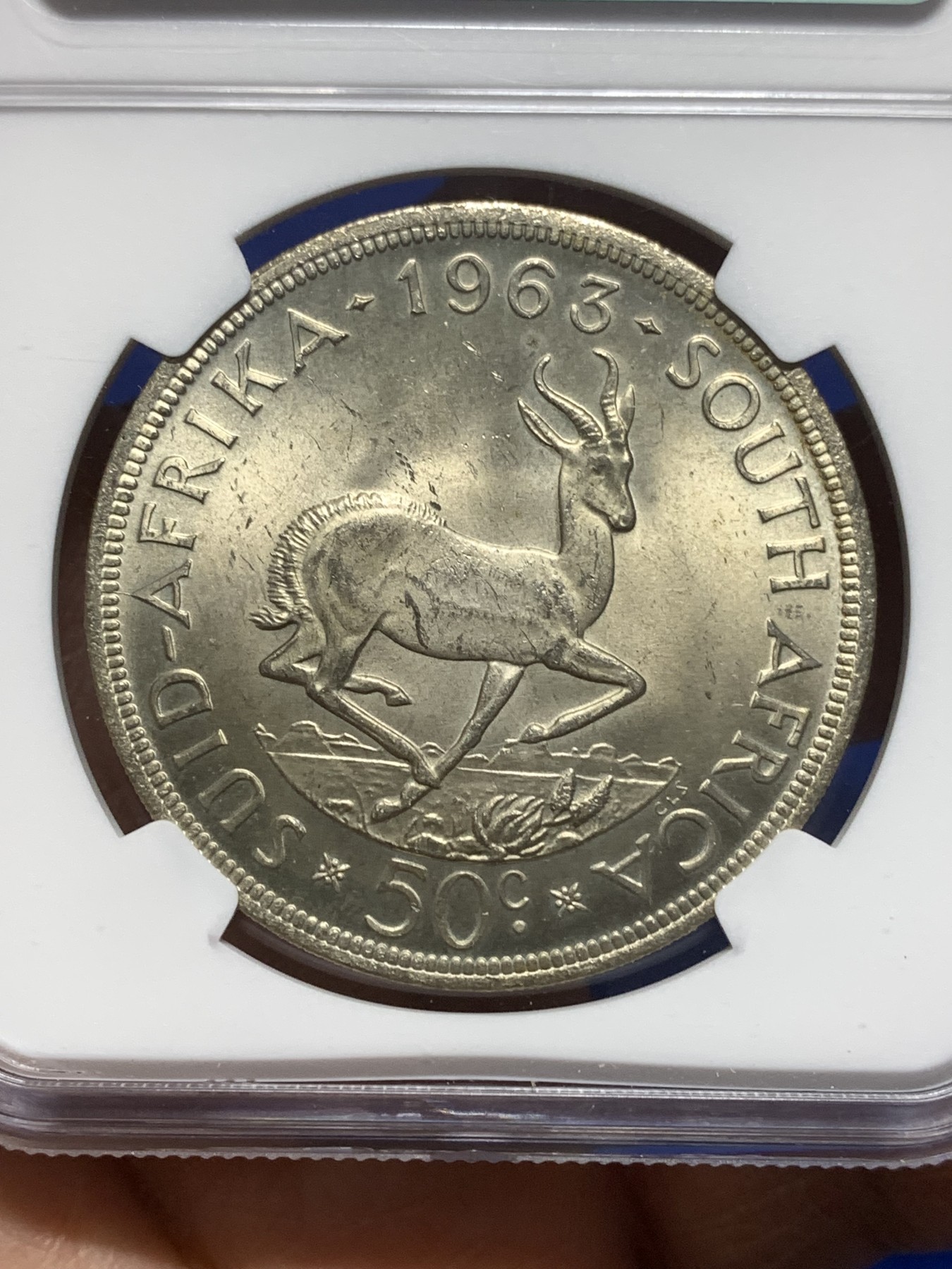 《竞宝斋》第215场-周日，周一 2场 (全场包邮) NGC-MS63 南非 1963年50分 吕贝克 大羚羊银币 极美黄包浆 MS-63 上海严评 早期天印67分砸盒结果