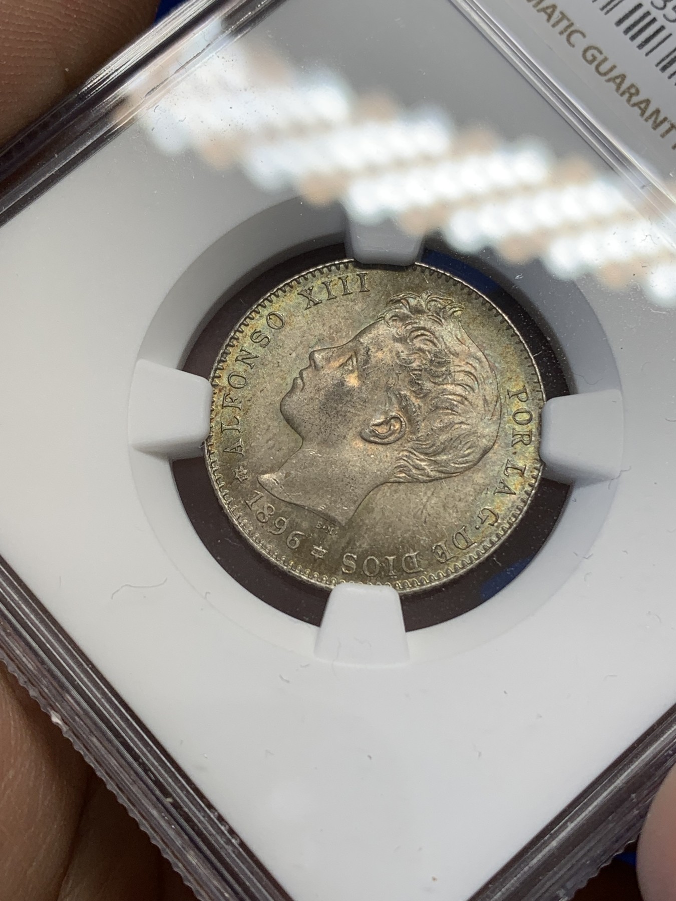 《竞宝斋》第215场-周日，周一 2场 (全场包邮) NGC MS64 西班牙1896年阿方索十三世1比塞塔银币 高分 五彩包浆 难得