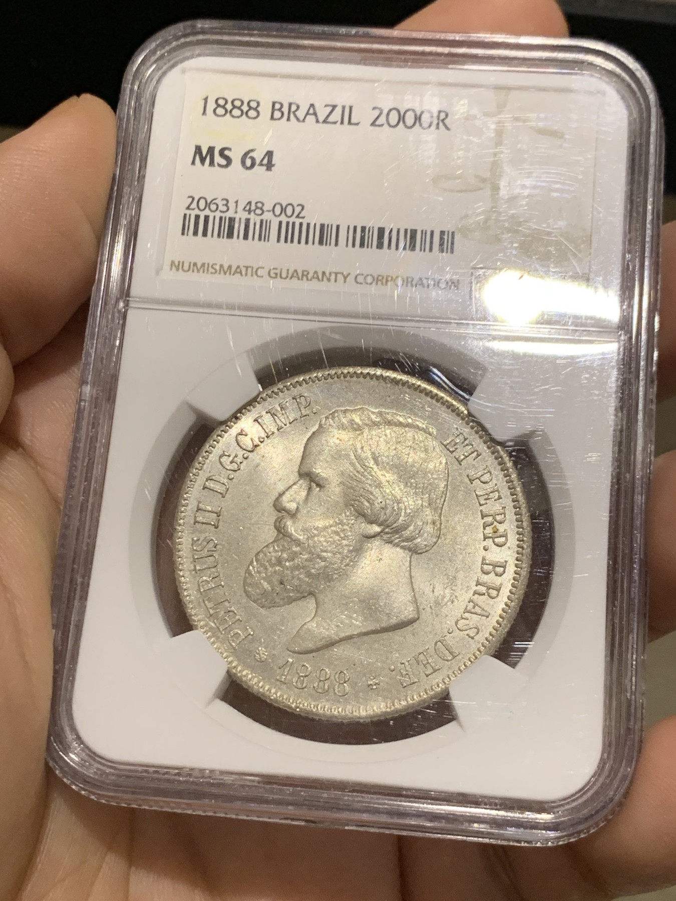 《竞宝斋》第215场-周日，周一 2场 (全场包邮) NGC-MS64 巴西 1888年2000瑞尔 佩德罗二世 大胡子银币 淡黄包浆 MS-64稀有高分一步到位 南美热点品种