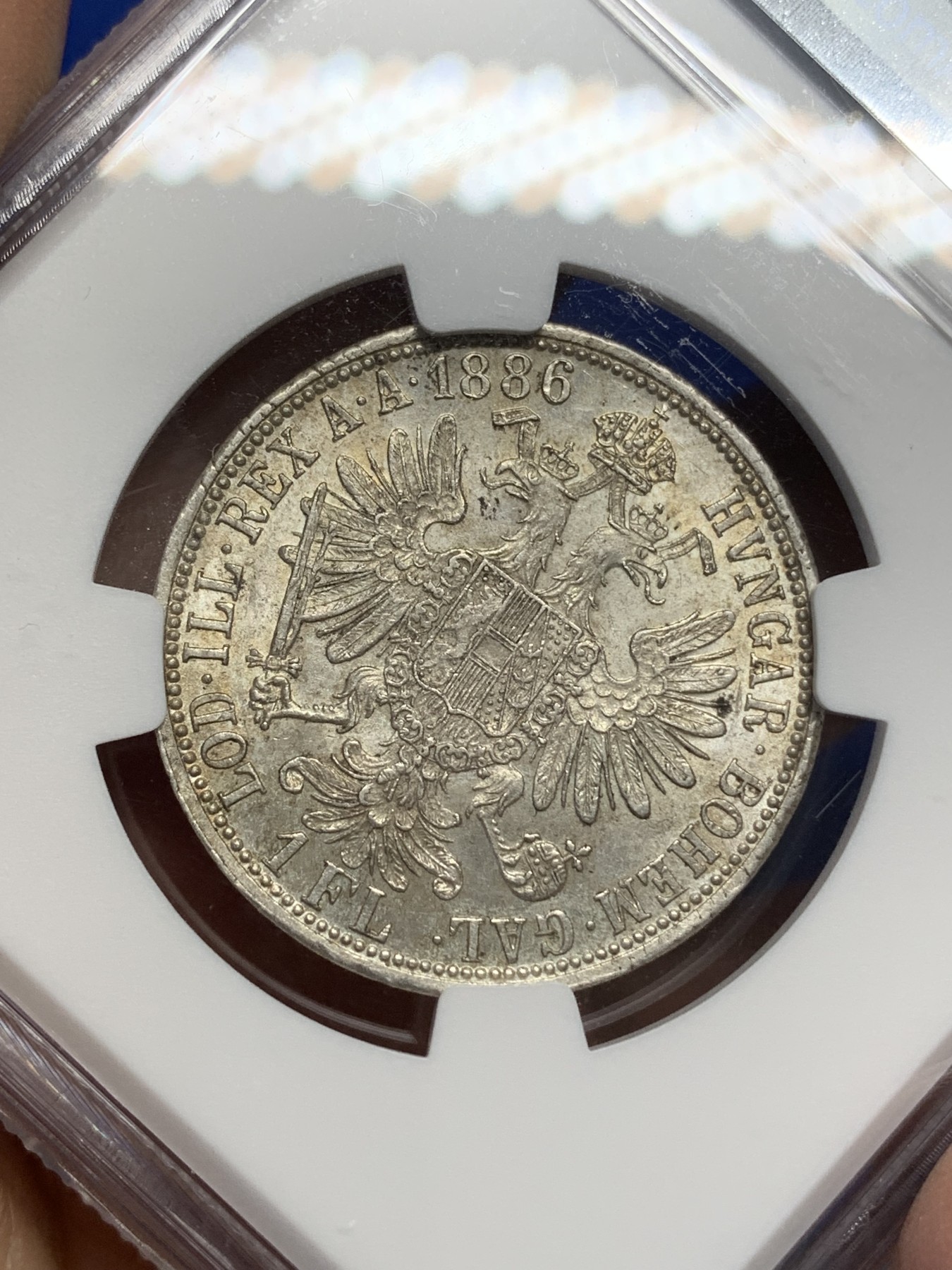 《竞宝斋》第216场-周日，周一 2场 (全场包邮) NGC-MS63 1886年奥匈帝国1弗罗林银币，弗朗兹约瑟夫皇帝像+双头鹰。底板丝滑，银光流畅。