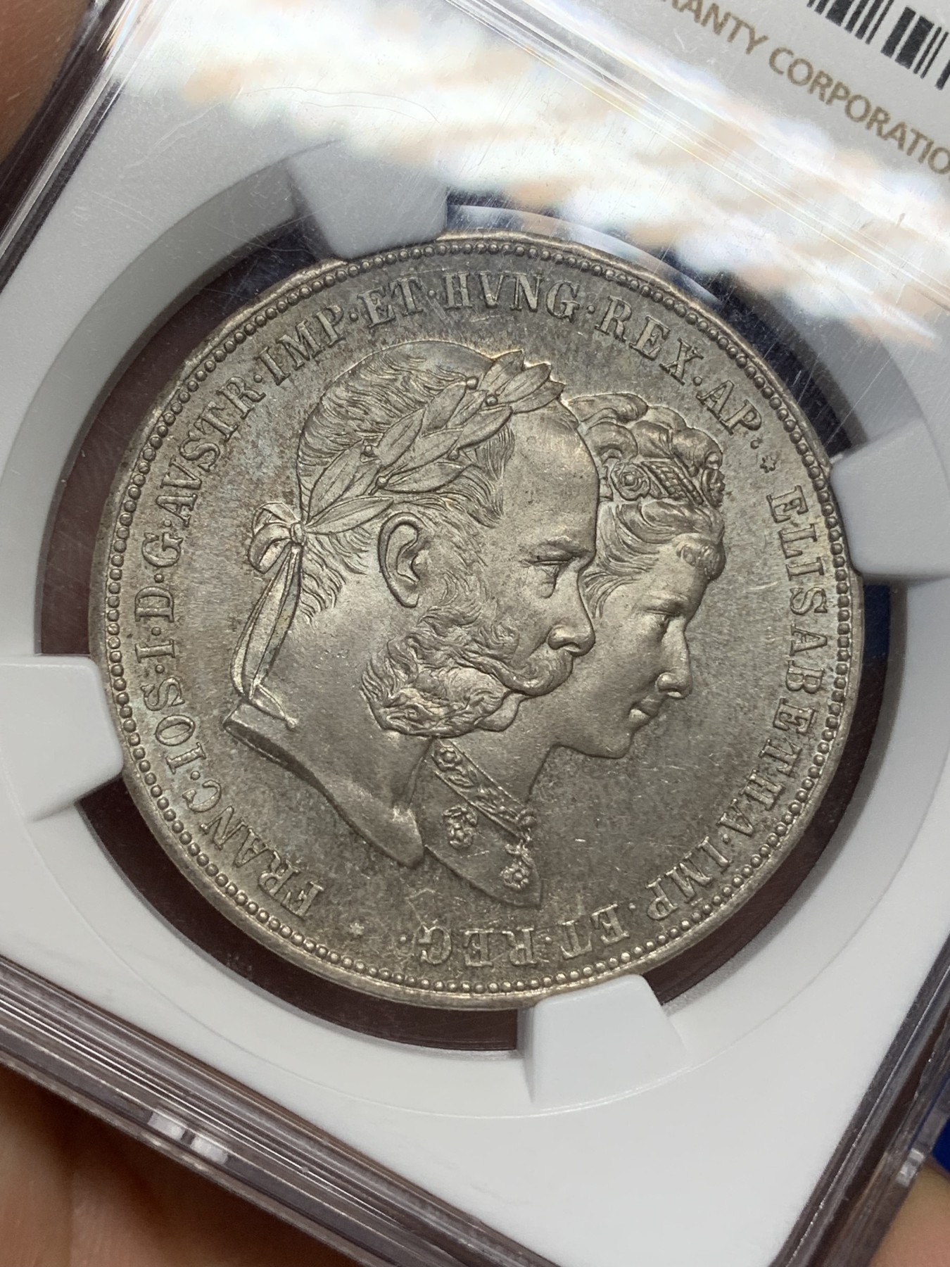 《竞宝斋》第216场-周日，周一 2场 (全场包邮) NGC-MS63 奥地利1879年茜茜公主结婚纪念 2福林=1泰勒 双面淡彩包浆 PL底板 感觉低评了