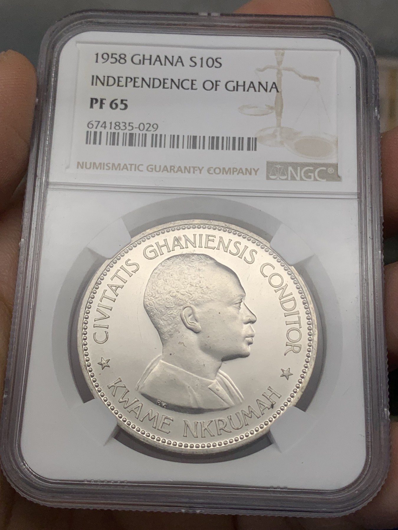 《竞宝斋》第218场-周日，周一 2场 (全场包邮) NGC-PF65 1958年加纳独立10先令大五星精制纪念银币，直径38mm，重28.28克，925银，发行量32691枚。镜面状态精制币，状态极佳，获得更高评分的数目6枚。