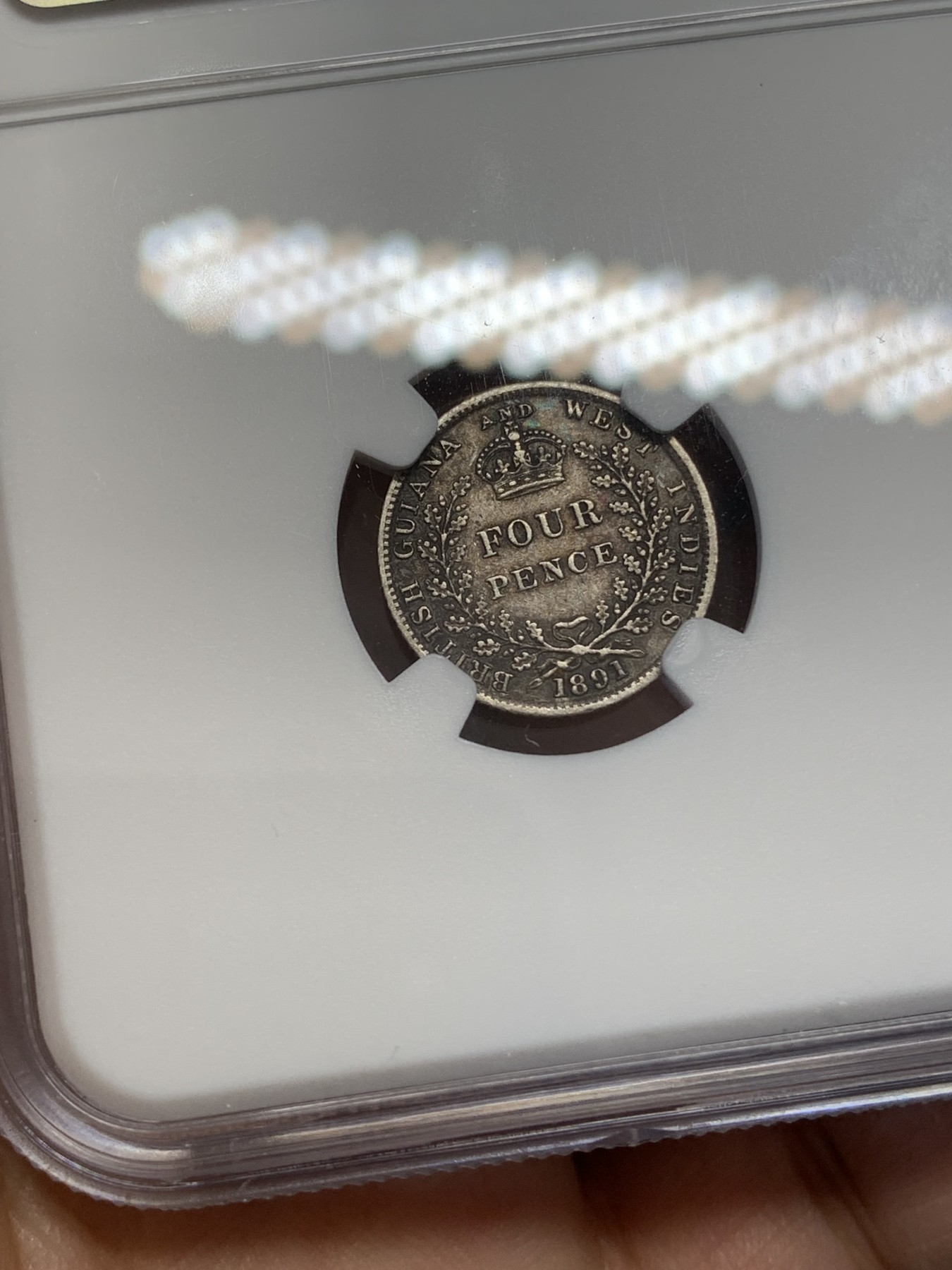 《竞宝斋》第218场-周日，周一 2场 (全场包邮) NGC XF 1891年 英属圭亚那小维4便士银币 老包浆环彩 AU的高点细节 明显低评错杀