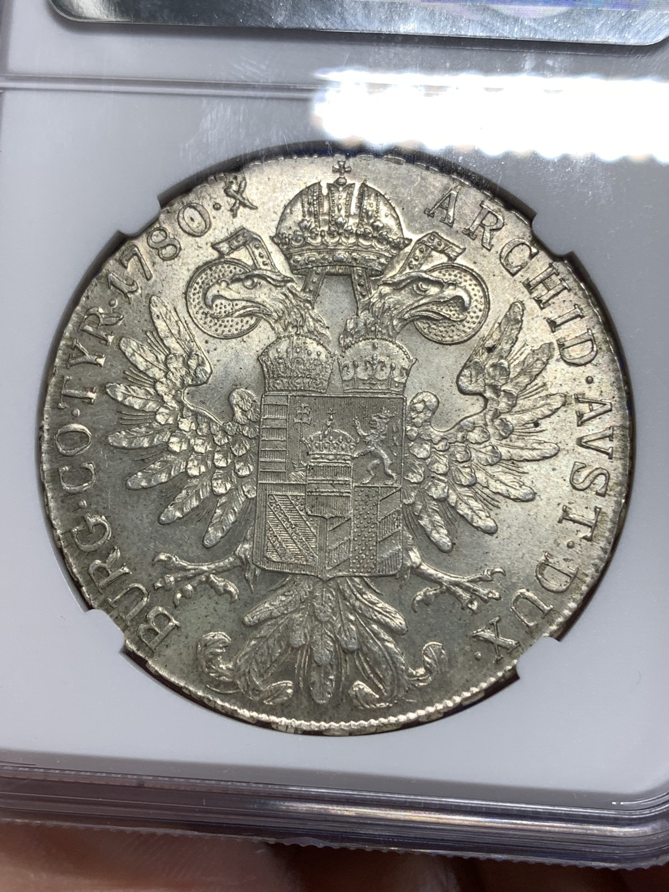 《竞宝斋》第218场-周日，周一 2场 (全场包邮) NGC-MS64 1780年奥地利大奶妈1泰勒银币，后铸，淡黄色包浆十分精美。