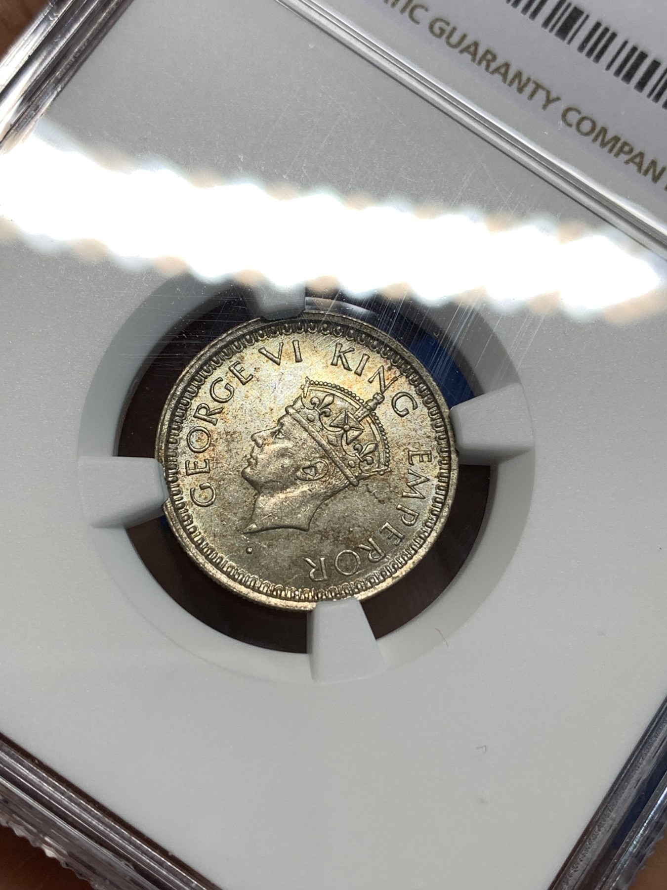 《竞宝斋》第219场-周日，周一 2场 (全场包邮) NGC-MS63 英属印度 乔治六世1/4卢比银币 孟买厂出品小五版本 双面淡五彩包浆