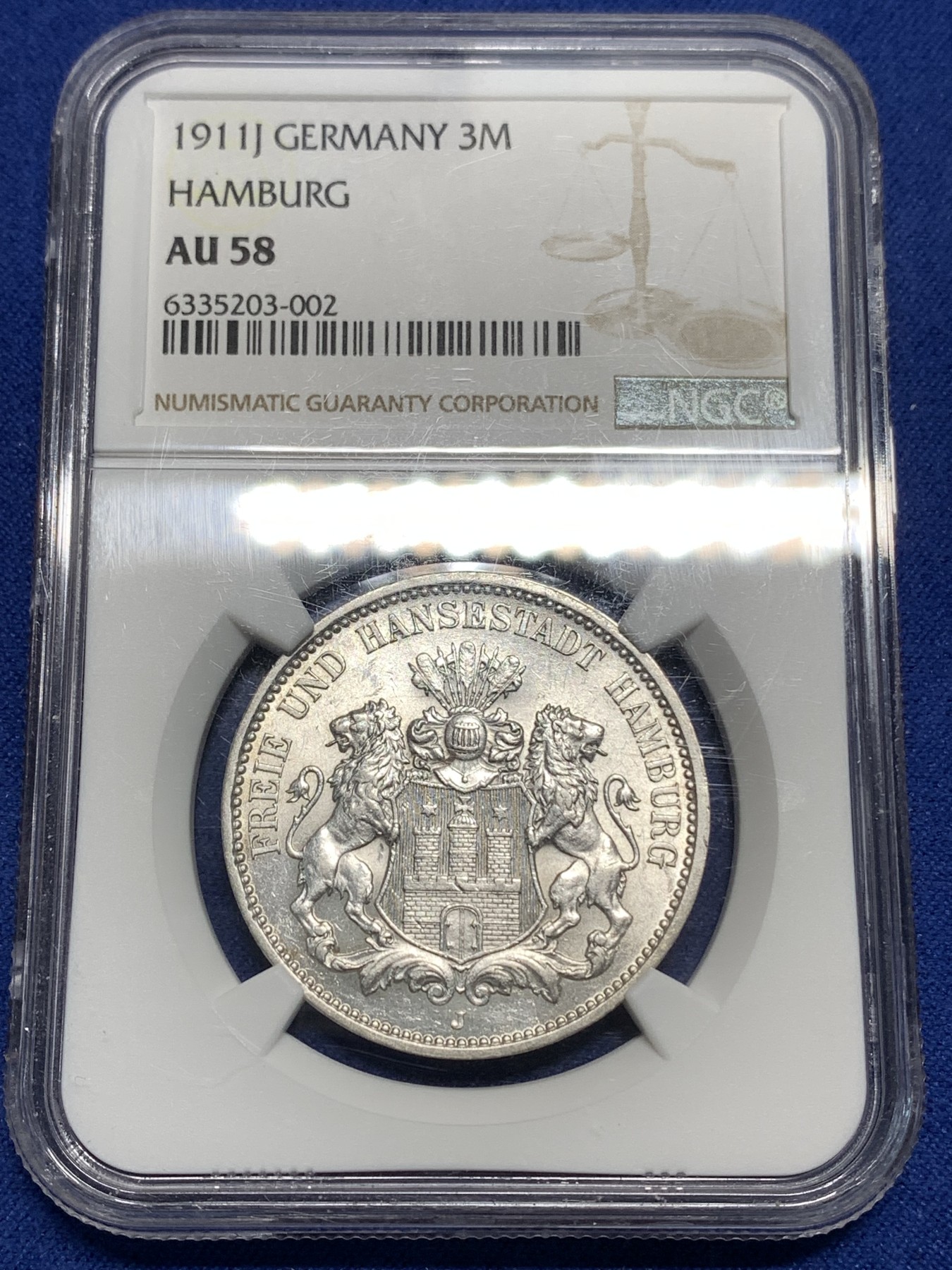 《竞宝斋》第221场-周日，周一 2场 (全场包邮) NGC-AU58 德国1911年汉堡自由市3马克银币，图案精美，纹饰优雅，历史价值浓郁。原汁原味老包浆，低评，状态绝对不输MS品质，非常漂亮，AU58超高的性价比，获得更高评分数量才95枚。