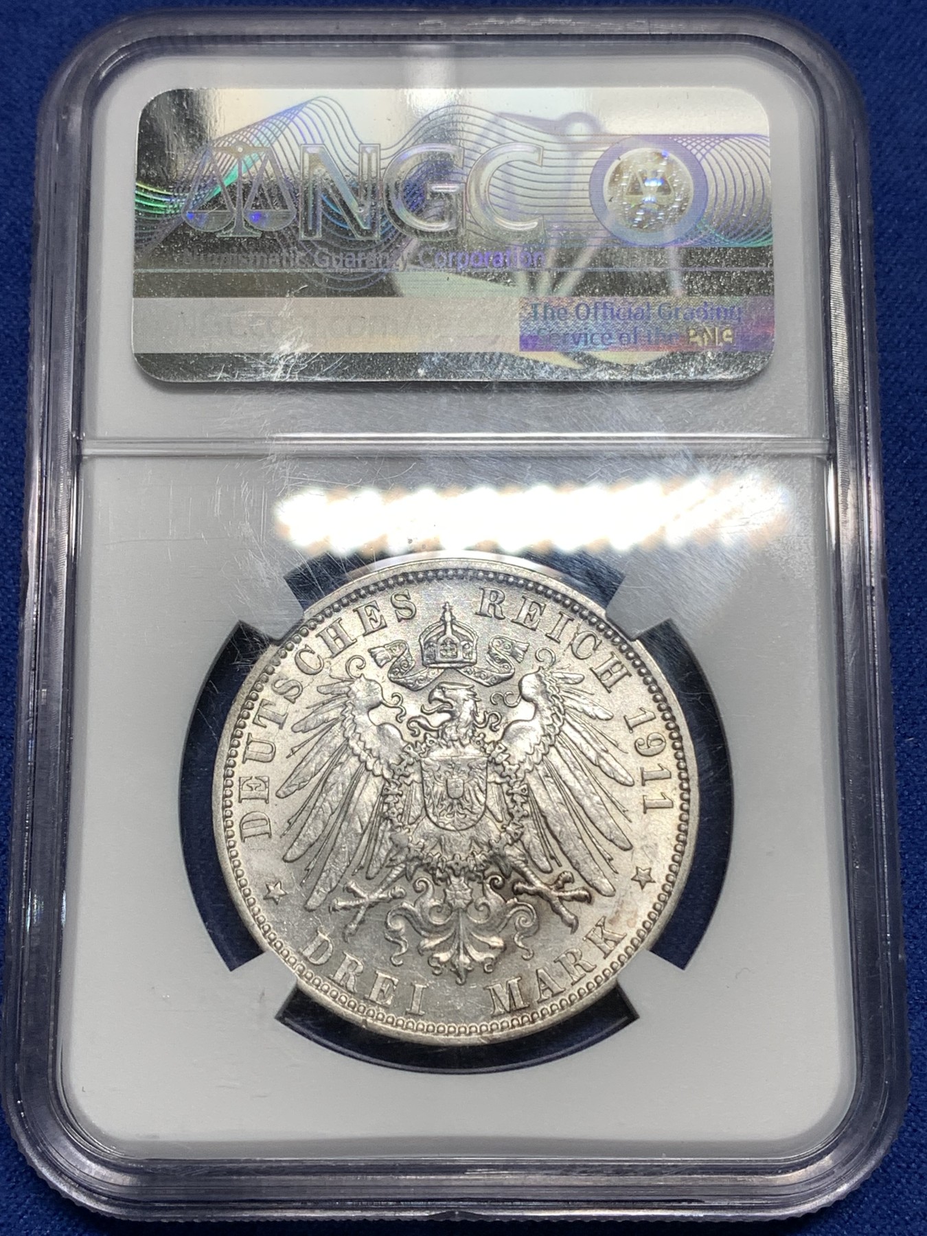 《竞宝斋》第221场-周日，周一 2场 (全场包邮) NGC-AU58 德国1911年汉堡自由市3马克银币，图案精美，纹饰优雅，历史价值浓郁。原汁原味老包浆，低评，状态绝对不输MS品质，非常漂亮，AU58超高的性价比，获得更高评分数量才95枚。
