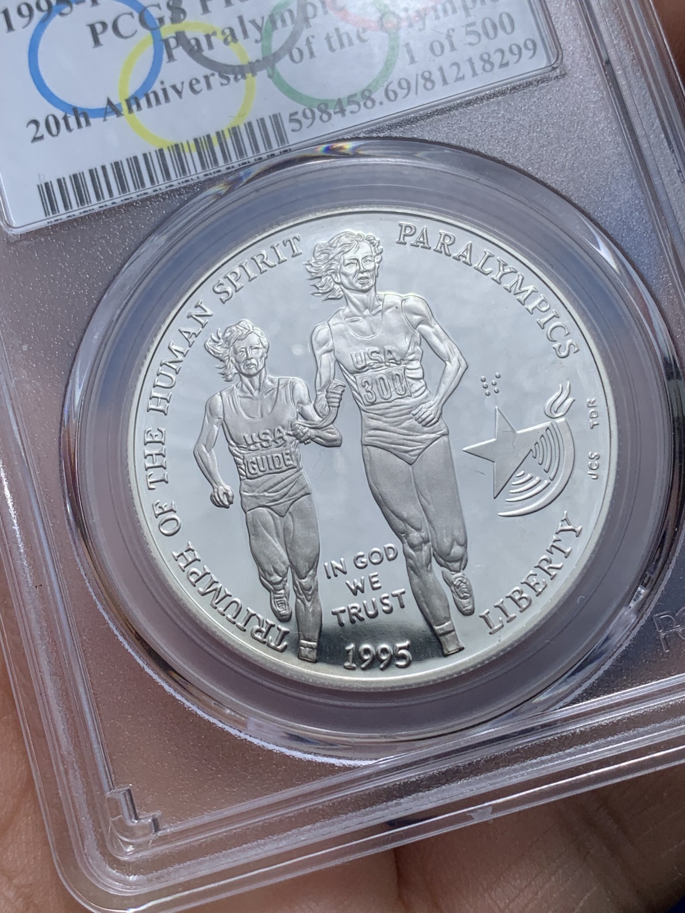 《竞宝斋》第221场-周日，周一 2场 (全场包邮) PCGS-PR69 美国1995年残奥会1美元精制纪念银币 ，PROOF全新镜面状态精制币，状态极佳，更高评级数量才25枚。