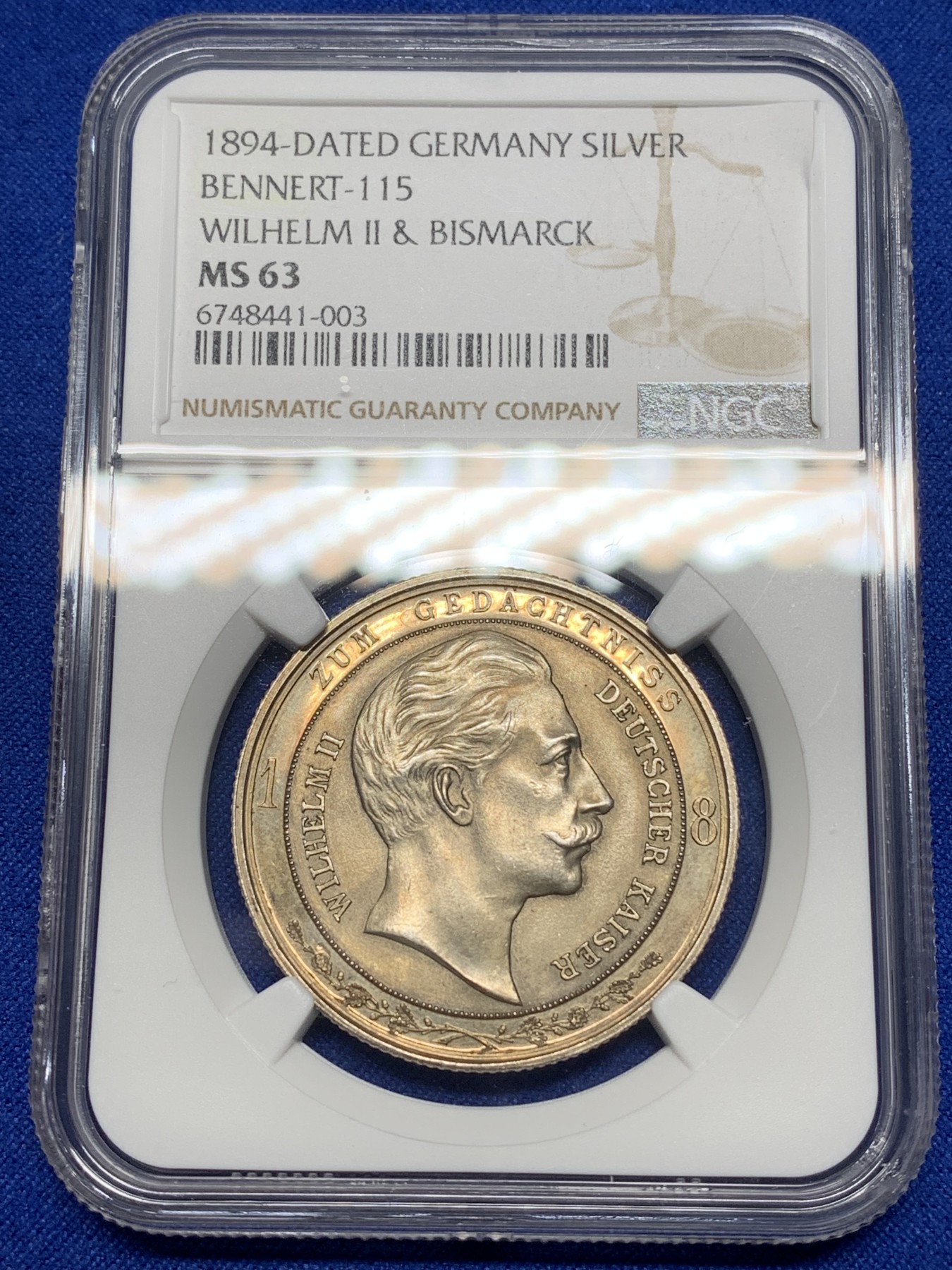 《竞宝斋》第221场-周日，周一 2场 (全场包邮) NGC-MS63 德国 1894年 威廉二世与俾斯曼和解银章 呈现Proof环形镜面 金色包浆 很经典的品种