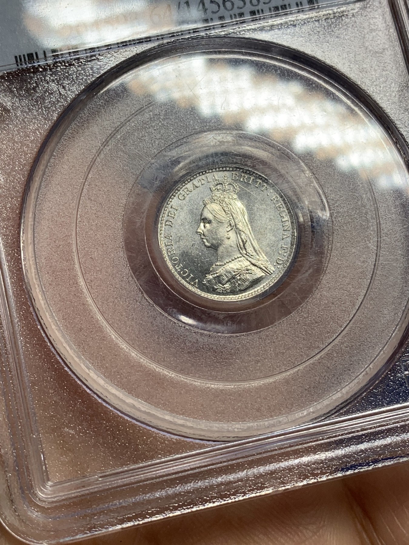 《竞宝斋》第221场-周日，周一 2场 (全场包邮) PCGS-MS64 英国1887年维多利亚高冠3便士银币  正面类镜面，头像虽小，发丝分明，项链上的珍珠颗颗圆润