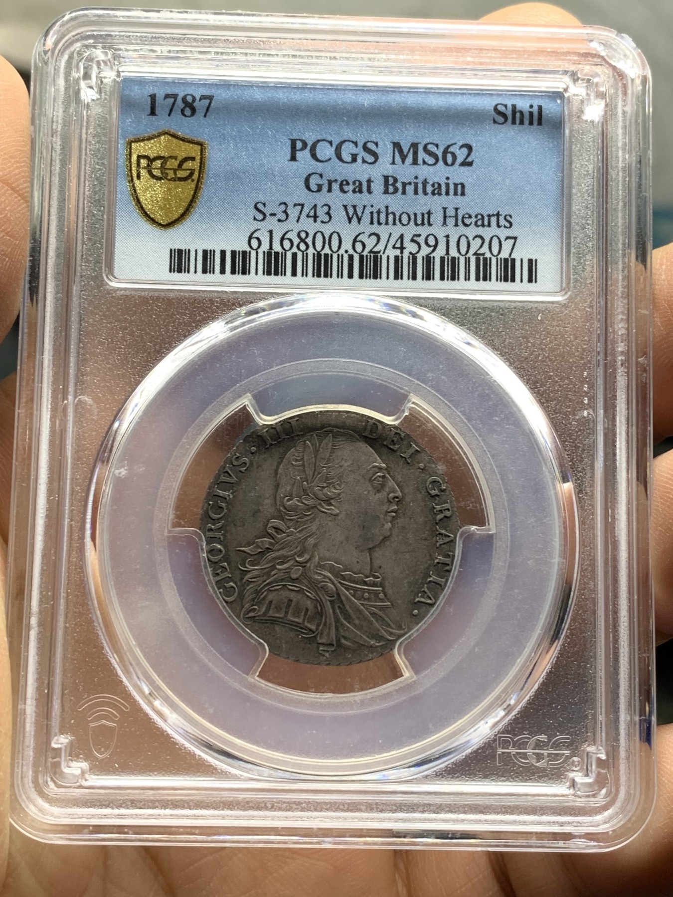 《竞宝斋》第222场-周日，周一 2场 (全场包邮) PCGS-MS62 英国 1787 乔三 1先令 银币  较少见的无心版 深包浆漂亮带彩