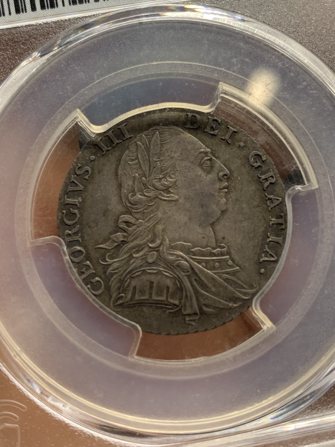 《竞宝斋》第222场-周日，周一 2场 (全场包邮) PCGS-MS62 英国 1787 乔三 1先令 银币  较少见的无心版 深包浆漂亮带彩