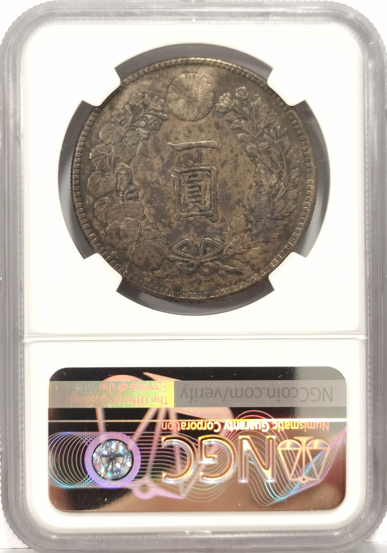 博洋堂世界钱币拍卖第056期（全场包邮） NGC AU 明治四十五年日本壹圆龙洋。正反满黑色五彩包浆状态非常讨喜，最近黑色包浆的日龙非常抢手