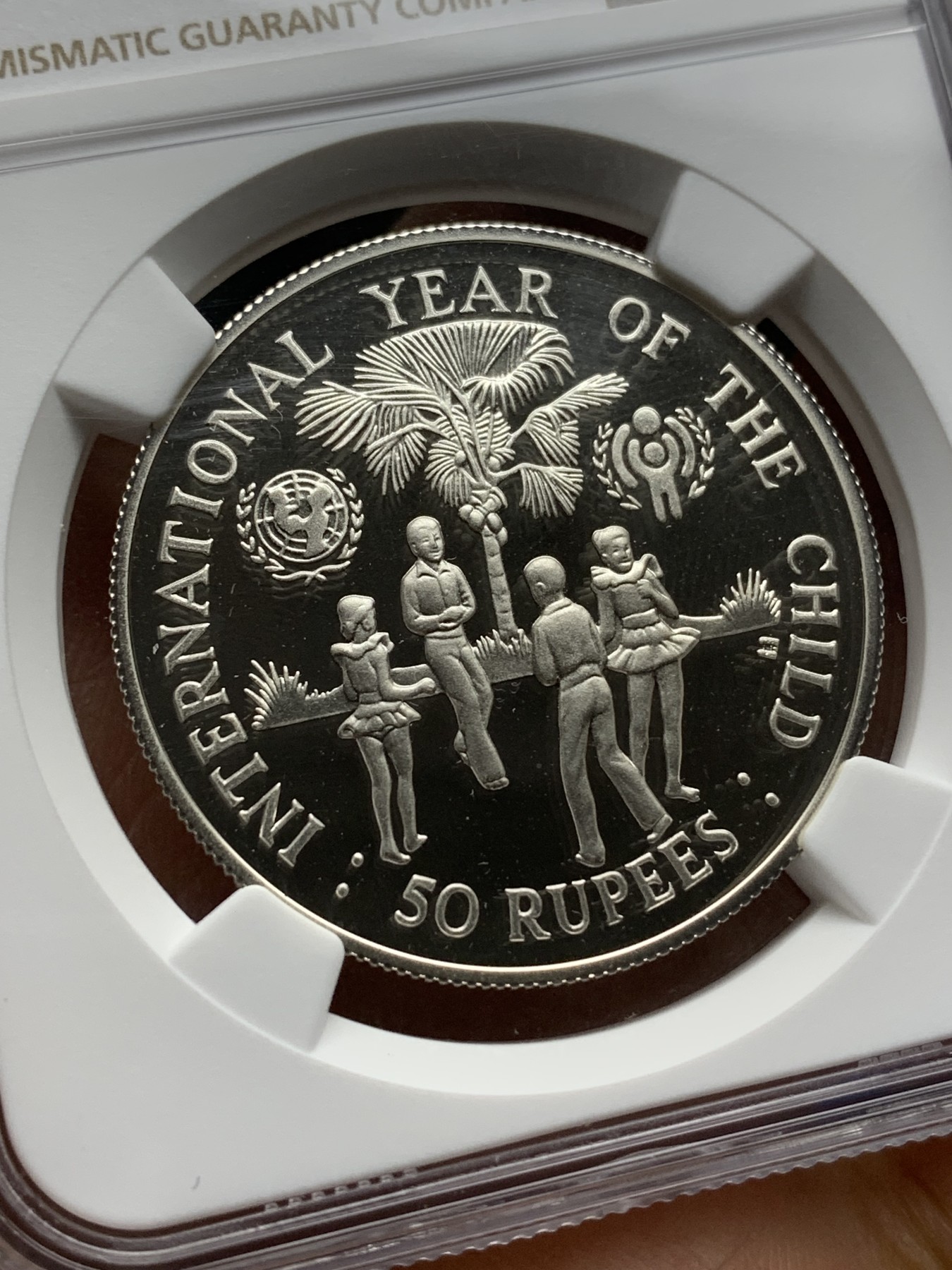 《竞宝斋》第225场-周日，周一，周二 3场 (全场包邮) NGC PF69UC 塞舌尔1980儿童年银币