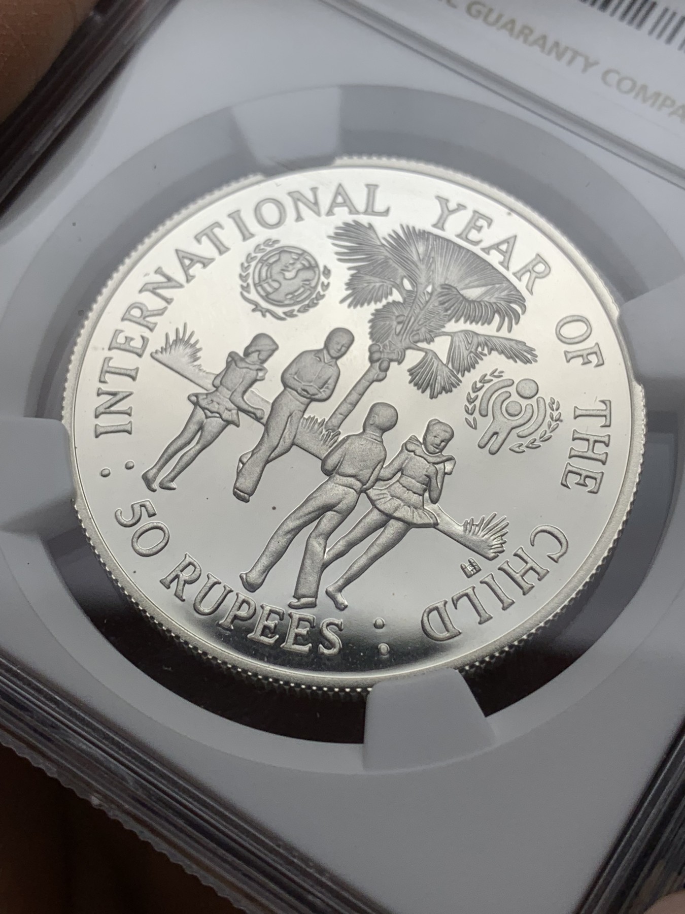 《竞宝斋》第225场-周日，周一，周二 3场 (全场包邮) NGC PF69UC 塞舌尔1980儿童年银币