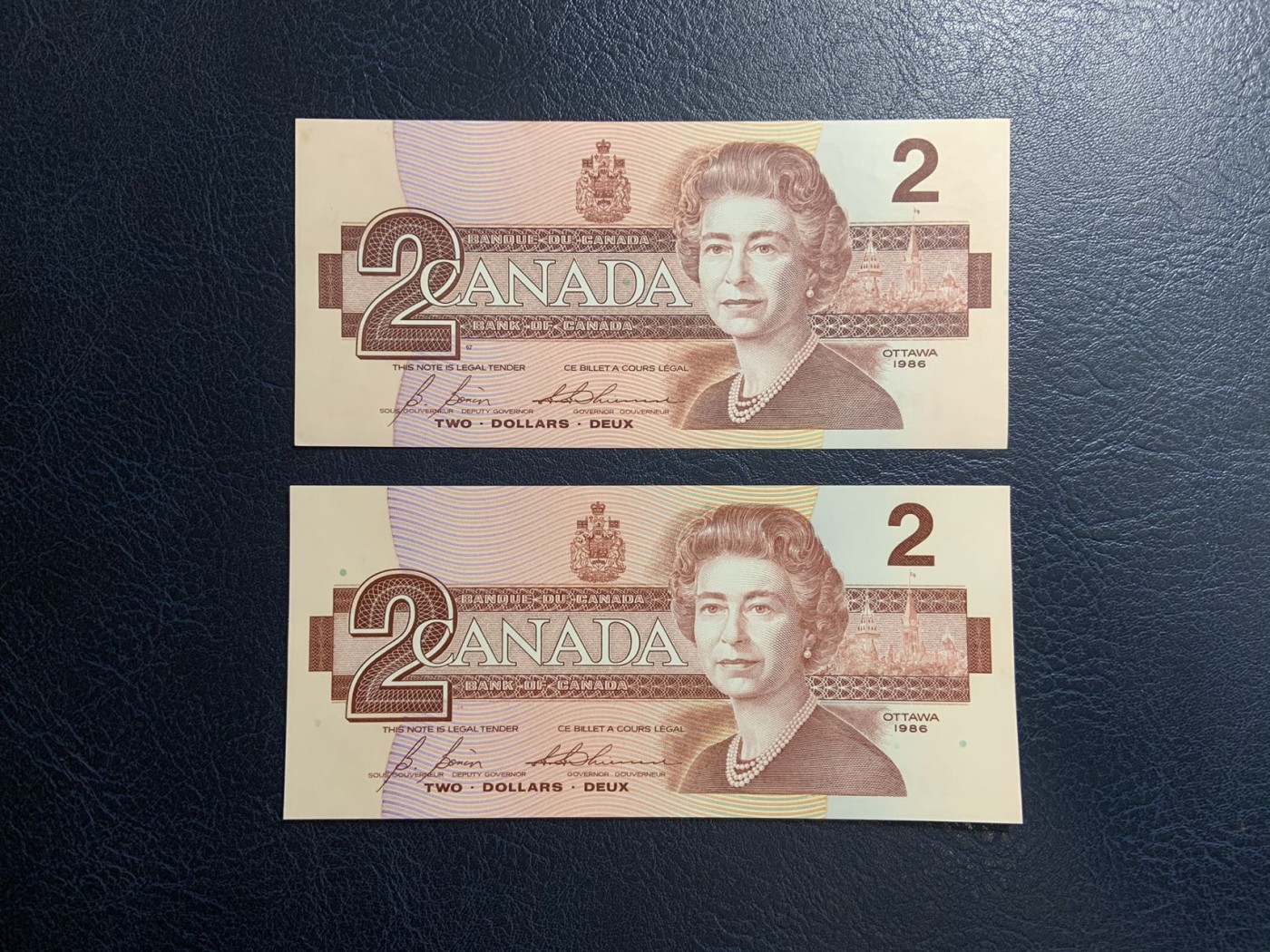 收藏联盟Quantum Auction 第312期拍卖  加拿大1967到1986年1元和2元 品相UNC 1967年1元纪念钞有点钞痕，1986年2元一张为UNC-