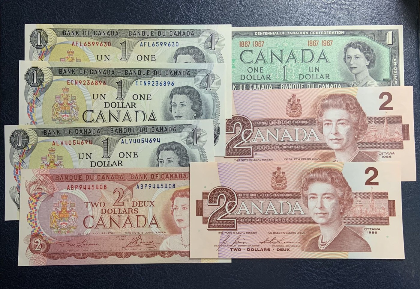 收藏联盟Quantum Auction 第312期拍卖  加拿大1967到1986年1元和2元 品相UNC 1967年1元纪念钞有点钞痕，1986年2元一张为UNC-