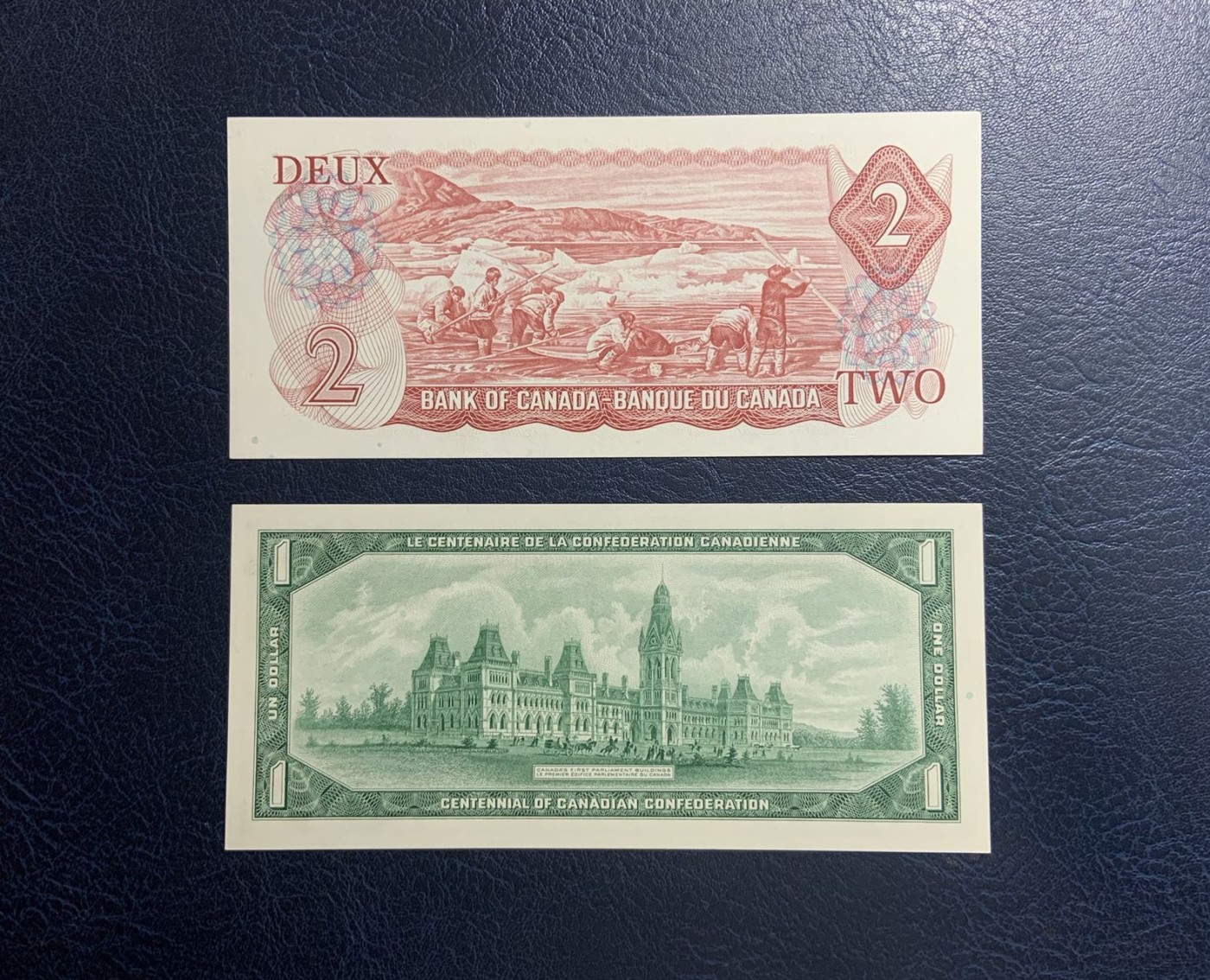 收藏联盟Quantum Auction 第312期拍卖  加拿大1967到1986年1元和2元 品相UNC 1967年1元纪念钞有点钞痕，1986年2元一张为UNC-
