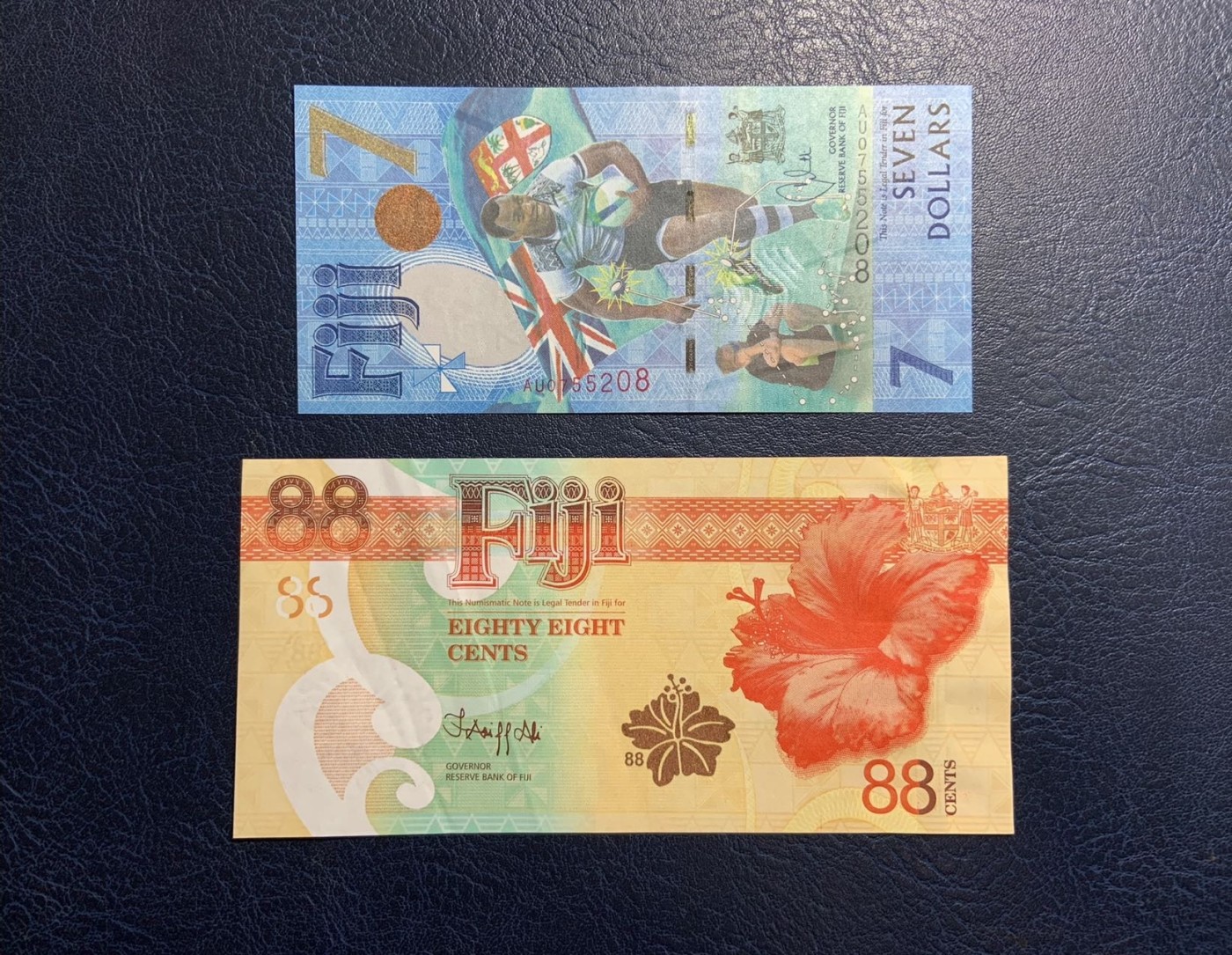 收藏联盟Quantum Auction 第313期拍卖  斐济2017年7元橄榄球夺冠和2022年88分财神爷纪念钞 品相分别为UNC和AU-